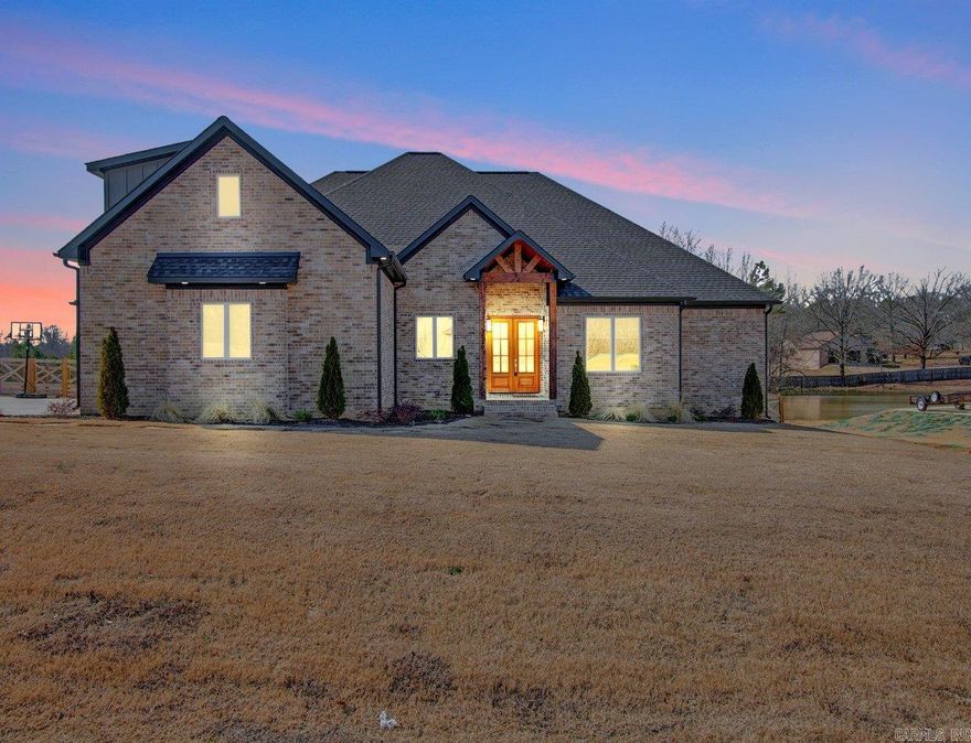 Spacious well laid out home built in 2023, situated on 1-acre lot located in newer subdivision. Enjoy this ideal combination of country living with close proximity to Little Rock and easy access to amenities.  The backyard is cross fenced and features a huge back patio with cathedral wood ceiling, outdoor fireplace, and plenty of room to add a shop or other outdoor amenities.  This home offers 4 bedrooms on the ground floor, plus a bonus room and bathroom upstairs.  Kitchen features ample cabinetry, quartz countertops, high end appliances, huge walk-in pantry. Living room has fireplace with built ins and floating shelves. You will also find a spacious laundry room and built in mud area.  Primary suite has ample space for sitting area, spa like bathroom with free standing tub and 2 shower heads. You will find a 3-car garage with ample parking on the driveway. SEE 3D VIRTUAL TOUR!  Don't miss this gem in a beautiful country setting!