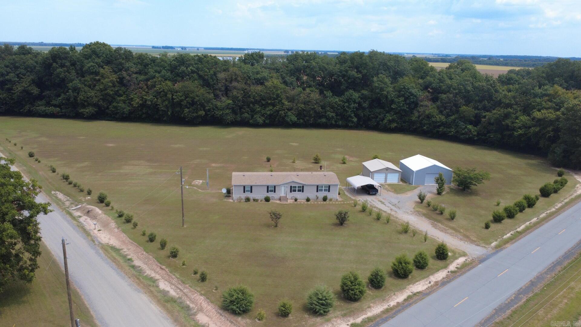Very nice mobile home on 4.12 acres in a peaceful rural setting. New roof installed in June. Property includes two shops, both have electricity, one has an electric garage door and contains a concrete pad. Both shops provide great workspace or storage options. The property has been well maintained and is move-in ready.