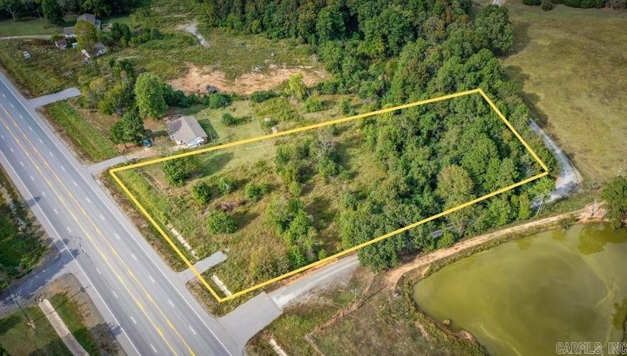 Looking for a prime location directly on Hwy 65? Here you will find 2.14 acres ready to go for your next business, RV spot, or homesite with Highway 65 frontage just outside of Clinton between Bee Branch and Choctaw. City Water and Electric available at the road.