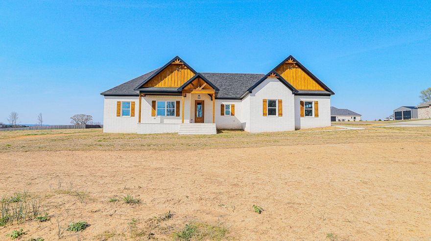 Beautiful New Construction featuring 4 bedrooms and 2.5 bathrooms. This open-concept floor plan makes excellent use of every square foot. The spacious kitchen includes a large island, and the living area offers a cozy fireplace. The laundry room features a locker-style drop zone, and the closets come with built-ins for added organization. Enjoy outdoor living on the covered back porch, perfect for entertaining. The home also includes a partially floored attic for extra storage. All of this sits on approximately one acre. Taxes are estimated on the lot only. This is a must-see! PROFESSIONAL PHOTOS TO FOLLOW !!!!!!