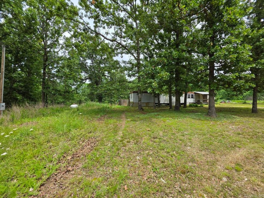 Unrestricted 5-Acre Retreat Near the Spring River! ?Escape to the Ozarks! Nestled just outside Mammoth Spring, this 5-acre property offers the perfect blend of mature shade trees, open space, and ultimate freedom. With no restrictions, the possibilities here are truly endless—whether you want to build your dream home, pull in an RV, start a hobby farm, or simply enjoy a private weekend getaway. Whether you're looking for an affordable fixer-upper project or a beautiful piece of land to start fresh, this property is a rare find in a highly sought-after river area. ?Bring your tools, your vision, and your sense of adventure—properties with utilities and no restrictions don't last long!