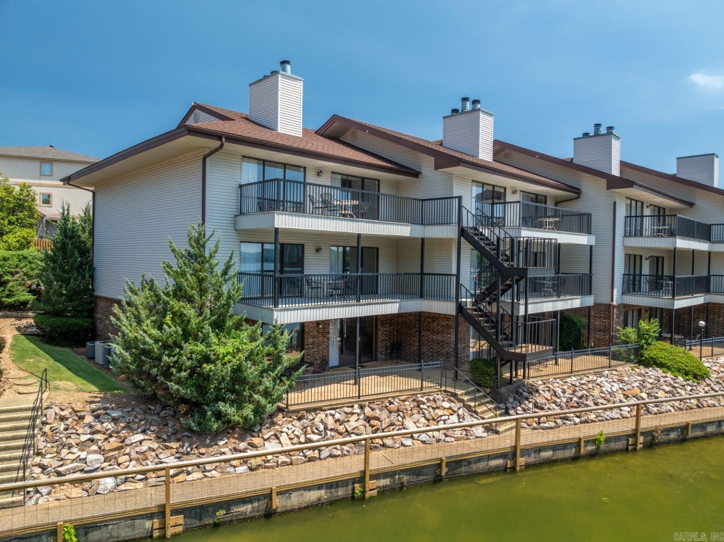 Experience lakeside living in the sought-after 7 South area of Lake Hamilton! This 2-bedroom, 2-bath condo spans 1,200 square feet and boasts stunning views. Enjoy amenities like a pickleball court, volleyball, and a luxurious resort-style pool. Fully furnished and situated in a gated community, this lakefront condo offers boat slip rentals and allows short-term rentals (STR). Schedule a private showing today!