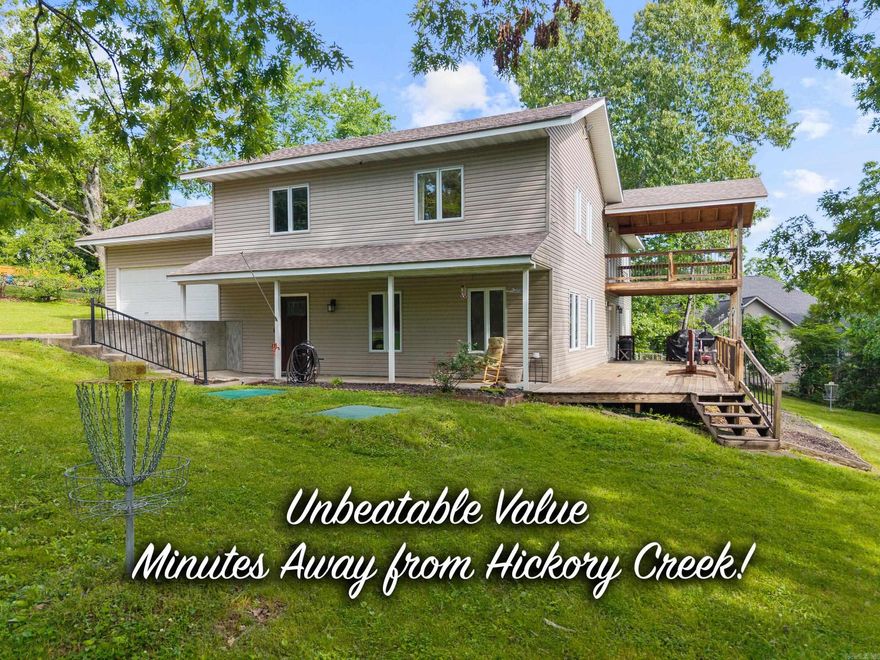 Welcome home to space, flexibility, and exceptional value! Whether you are searching for a full-time residence, a weekend getaway, or a high-performing Airbnb or VRBO investment, this property delivers an unbeatable price per square foot with so many updates already done! The expansive layout allows room to add two to three additional beds, maximizing comfort and income potential. Set on a generous lot just minutes from Hickory Creek Marina, this home offers privacy and convenience in a prime location. The bright, open-concept living area connects the kitchen, dining, and living spaces, creating an inviting setting for entertaining and comfortable daily living. Step outside to a 12' x 45' deck built for gatherings, cookouts, or peaceful evenings overlooking your spacious backyard. Upstairs, a massive bonus room offers endless versatility. Picture a media room, game room, home gym, office, or private guest retreat with its own kitchenette. The primary suite features a private deck with backyard views and a beautifully remodeled ensuite bath for a relaxing retreat. With its size, flexibility, and pricing, this home stands out in the area. Schedule your private showing today!