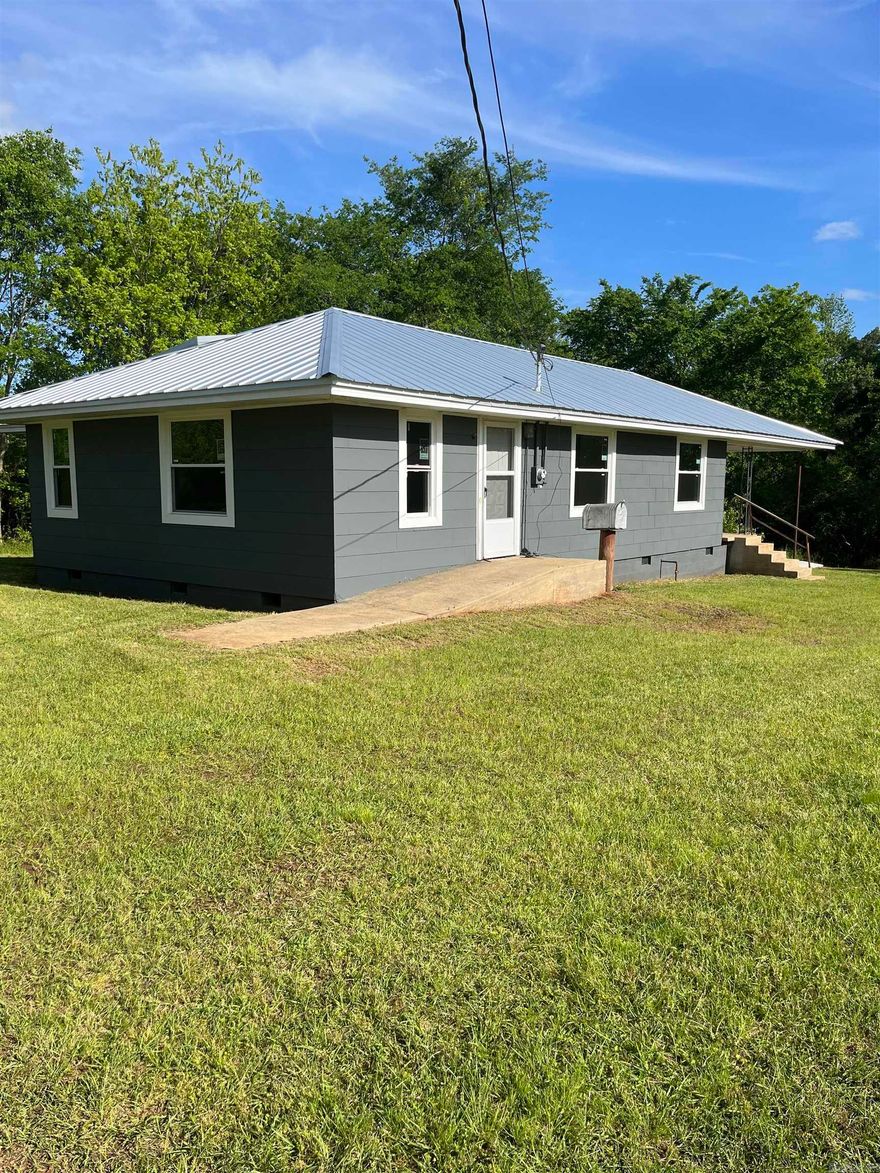 Excellent price for 15 acres. This remodeled and updated home is waiting for your finishing touches. It has updated plumbing, electrical, windows, paint inside and out. It sits on 15 acres of land. You will not find this anywhere else in Ouachita County. Home is handicapped equipped. Land is gently rolling and has  numerous uses.  Let  your imagination and creativity go wild and come see this property. Deer and Turkey abound in the area . Gas easement runs south of the home and provides gas service to the property. One of only a few homes in the area with gas.  Concrete ramp, wider doorways makes it easy to get around in. 2 antique barns are in back. Has a nice covered deck on the back. There are possibilities that cannot be advertised publicly at this time. Call for appointment. Under contract backup offers are being accepted.