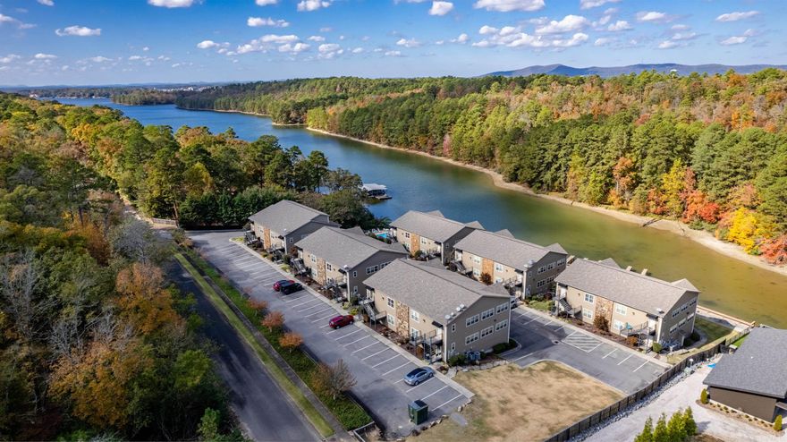 Bright and an open concept floorplan all with a lake view!! The high ceilings and gas fireplace will give you the best of both worlds.  The kitchen is well appointed with stainless appliances to prepare the best of foods to enjoy for a boat ride or while sitting on your balcony overlooking the water.