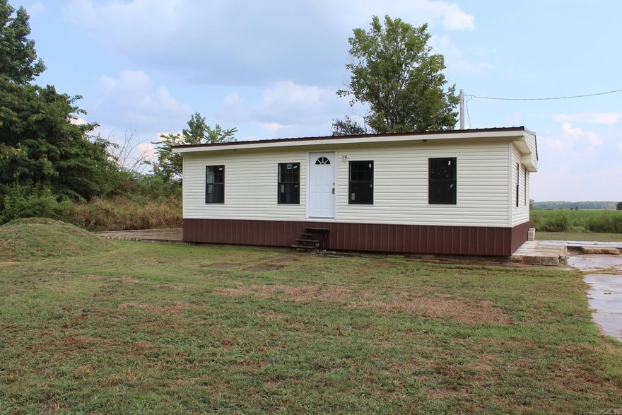 Discover affordable, tranquil living in this impeccably newly remodeled  country mobile home. Nestled on quiet country lots, this beautifully updated mobile home offers a peaceful retreat from the city hustle. The open-concept living area is filled with natural light with an inviting atmosphere.  Imagine waking up to the sounds of nature and unwinding each evening under a star-filled country sky. This captivating mobile home is not just a house; it is a lifestyle. The expansive yard is a tranquil oasis, ideal for gardening, family gatherings, or simply enjoying the peaceful surroundings. Come find your freedom and embrace the simplicity of stylish country living.