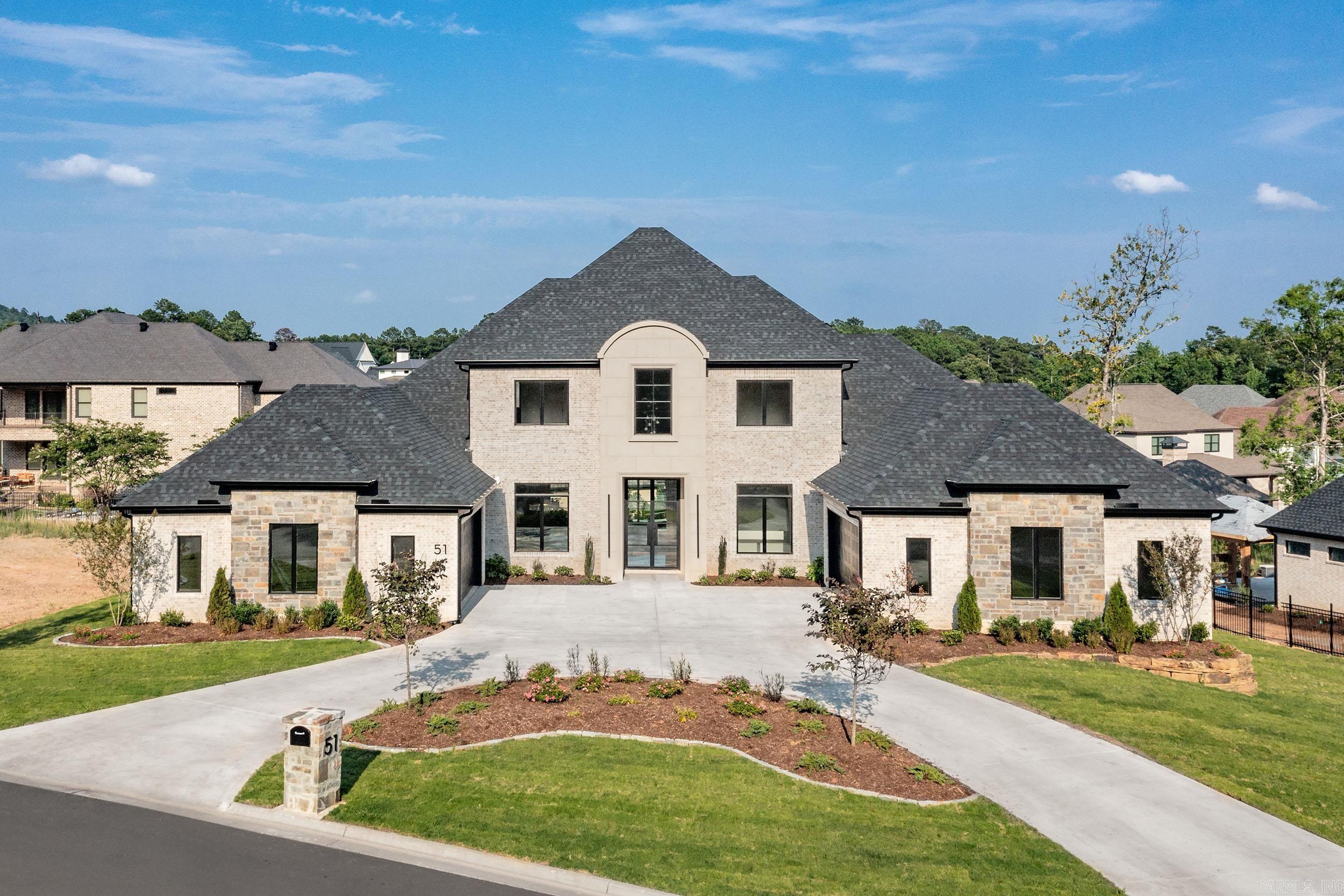 Stunning new construction in Chenal Valley's Orle neighborhood. French inspired traditional home with attention to detail. Primary Suite with two additional ensuite bedrooms on the main level. Two ensuite bedrooms upstairs with a Media Room & living space. Covered veranda with an outdoor fireplace. 4 car garage. Home office. Formal Dining plus a Breakfast Room. Vaulted Ceilings. Upscale appliances. Easy access to Chenal Country Club, Wildwood Park, dining, entertainment & schools.