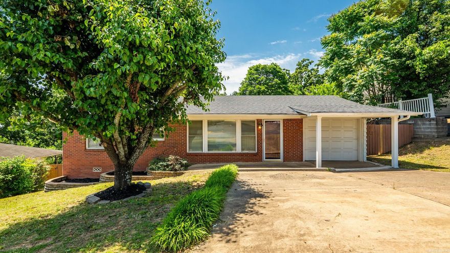 Charming starter home with thoughtful updates throughout! Features include a new roof (2025), insulated windows, original wood floors, updated kitchen cabinets with granite countertops, and a new bathroom vanity. The laundry area is conveniently located just off the kitchen. Enjoy the extra-large deck overlooking a spacious backyard in a quiet, park-like setting. A one-car garage and two parking pads provide plenty of parking. Move-in ready and waiting for its new owner to make it their own. **New stove coming this week!