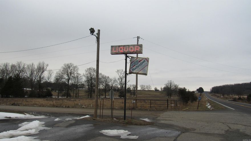 Liquor store on State Hwy Frontage and Countryside.