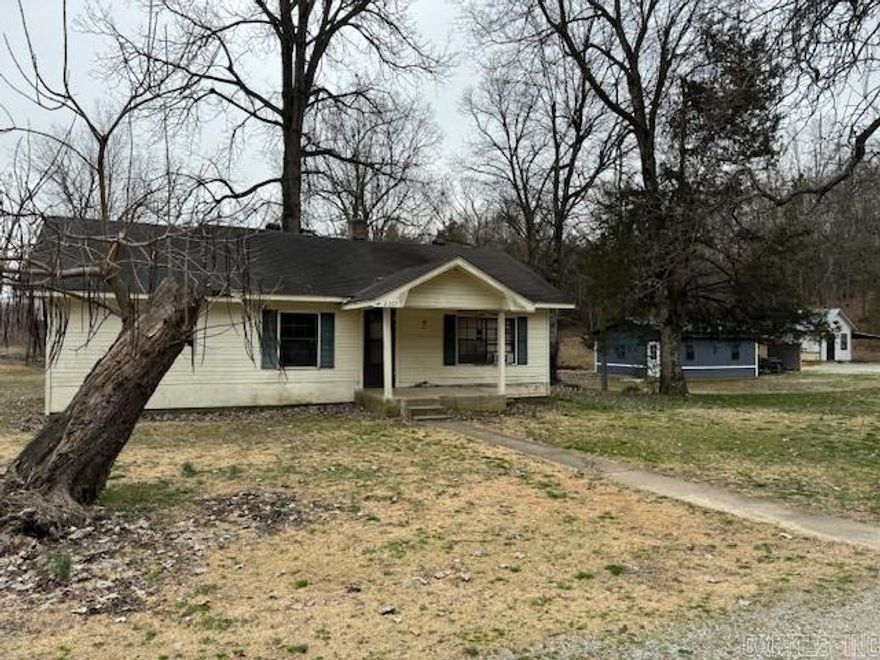 HOME-SHOP-CREEK ON 2.71 ACRES!  Fixer upper 960 square foot home is 2 bedroom and 1 bathroom. Nice 20X24 shop with concrete floor and double door. 10X16 building and 10X10 building. Sitting on banks of year round Mansker Creek. City utilities, Entergy and Summit Natural gas. 2.71 acres go all the way up to Lake Drive. (see attached aerial) Lots of potential with home and lots of fun with creek and gravel bar! Home will not qualify for RD, FHA or VA and is in a flood plane.