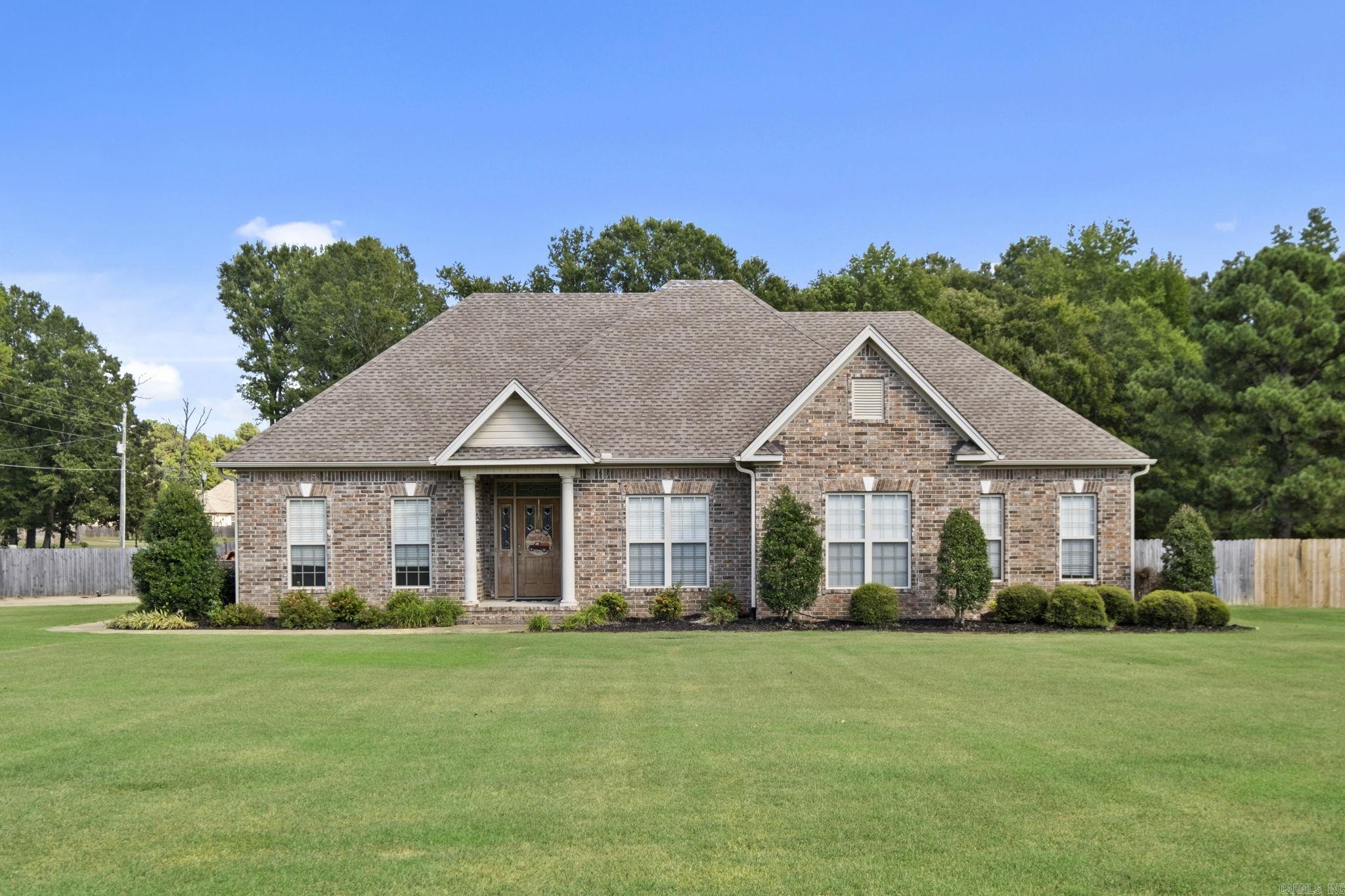 Beautiful custom built 4 bedroom, 2.5 bathroom home on large 1.77 acre corner lot in West Searcy just minutes from the Searcy Country Club. This home has several updates, 18x36 salt system pool, oversized 3 car garage: 2 car and 1 golf cart, crown molding/trim throughout, large kitchen, granite counter tops, brick backsplash, Kitchen Aid appliances, hand-scraped hardwood flooring, large living room area cozy fireplace, formal dining, breakfast area and a bar. The Master suite has a tray ceiling, wood flooring, door leading out to patio, large bathroom with double vanity, with a jacuzzi tub, large walk-in closet with a custom built in shelves. You will love the covered back porch overlooking the back yard where you can have cookouts with your family and friends or just relax in the pool. *Prequal letter or proof of funds required for showings.