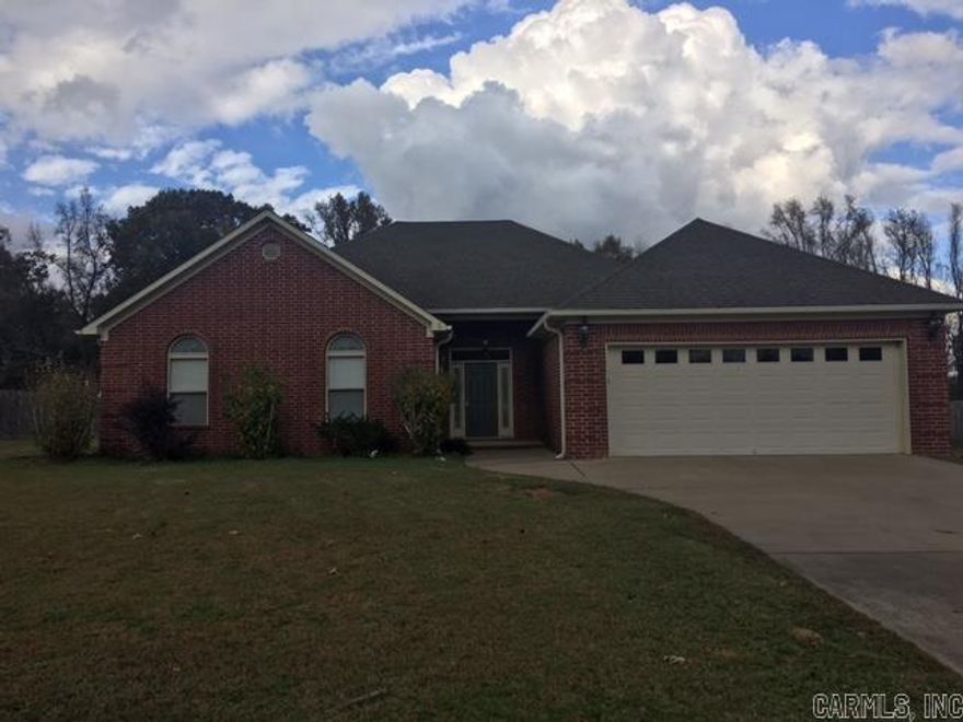 This beautiful 4 bedroom 2 bath home sits on a large lot with a fenced in back yard. The living area boasts a fireplace, spacious kitchen, crown molding throughout and  a split floor plan. Book your tour today!