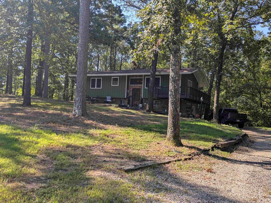 Recently Updated 4 Bedroom, 2 Bath Home with a New Roof on 1.92 Acres with Creek  – Mena, Arkansas. This 4 bedroom, 2 bathroom home has been recently updated and sits on 1.92 partially wooded acres just outside of Mena. The property offers a peaceful setting with a mix of open yard and shady mature trees, giving it plenty of natural ambiance. A wet-weather creek runs along the land, adding to the charm and country feel. Inside, updates bring a fresh, move-in ready appeal while keeping the home warm and inviting. With cozy living areas, comfortable bedrooms, and modern touches, it’s designed for both everyday living and weekend relaxation. Enjoy the quiet of a country setting while still being close to town — a rare find that combines updates, acreage, and natural beauty all in one. Plus, it has a brand new roof and new gutters!