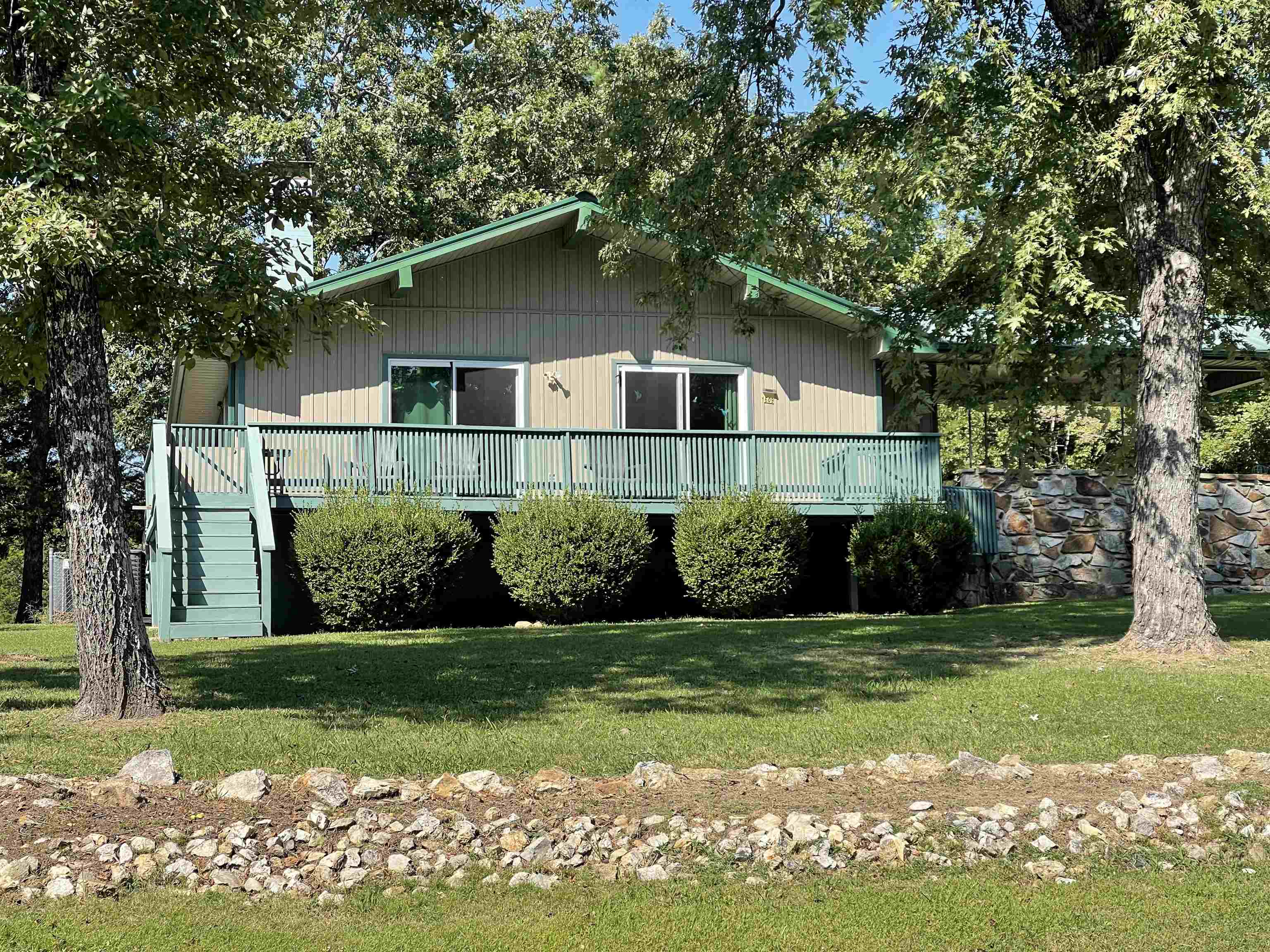 This charming and cozy 2-bedroom, 1.5-bathroom home with picturesque views of Crown Lake offers the perfect blend of comfort, convenience, and year-round recreational opportunities. Nestled on three lots, including a serene, wooded area, this 980-square-foot residence is an idyllic retreat for families or those seeking a peaceful escape. Step inside to a warm and inviting living room, where a cozy wood-burning stove creates the perfect ambiance for relaxing evenings. The well-equipped kitchen, complete with all appliances, ensures a seamless move-in experience. The homeās thoughtful design extends to its outdoor living spaces. A spacious wraparound deck (needs some repairs), provides an ideal setting for entertaining guests or simply soaking in the tranquil lake views. The property also boasts a fenced backyard, offering a safe and private space for pets and children to play. Recent upgrades provide peace of mind, including a new furnace and air conditioner installed in 2022 and a new septic system in 2024. Additional features enhancing this homeās appeal include a valuable whole-house generator, a dedicated storage building, and extra storage space adjacent to the house.