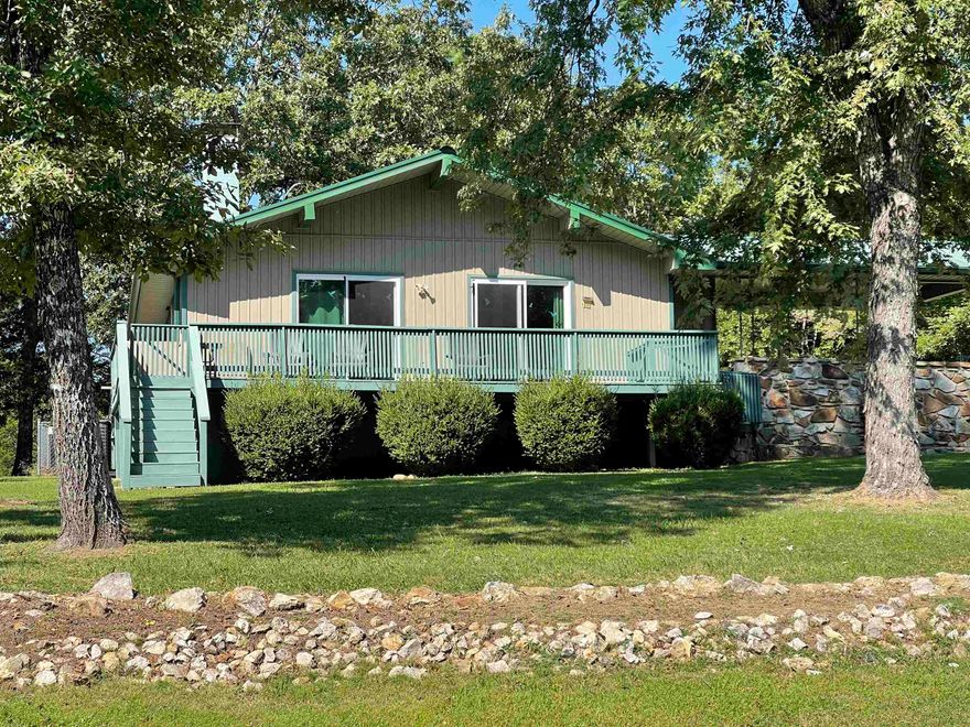 This charming and cozy 2-bedroom, 1.5-bathroom home with picturesque views of Crown Lake offers the perfect blend of comfort, convenience, and year-round recreational opportunities. Nestled on three lots, including a serene, wooded area, this 980-square-foot residence is an idyllic retreat for families or those seeking a peaceful escape. Step inside to a warm and inviting living room, where a cozy wood-burning stove creates the perfect ambiance for relaxing evenings. The well-equipped kitchen, complete with all appliances, ensures a seamless move-in experience. The home’s thoughtful design extends to its outdoor living spaces. A spacious wraparound deck (needs some repairs), provides an ideal setting for entertaining guests or simply soaking in the tranquil lake views. The property also boasts a fenced backyard, offering a safe and private space for pets and children to play. Recent upgrades provide peace of mind, including a new furnace and air conditioner installed in 2022 and a new septic system in 2024. Additional features enhancing this home’s appeal include a valuable whole-house generator, a dedicated storage building, and extra storage space adjacent to the house.