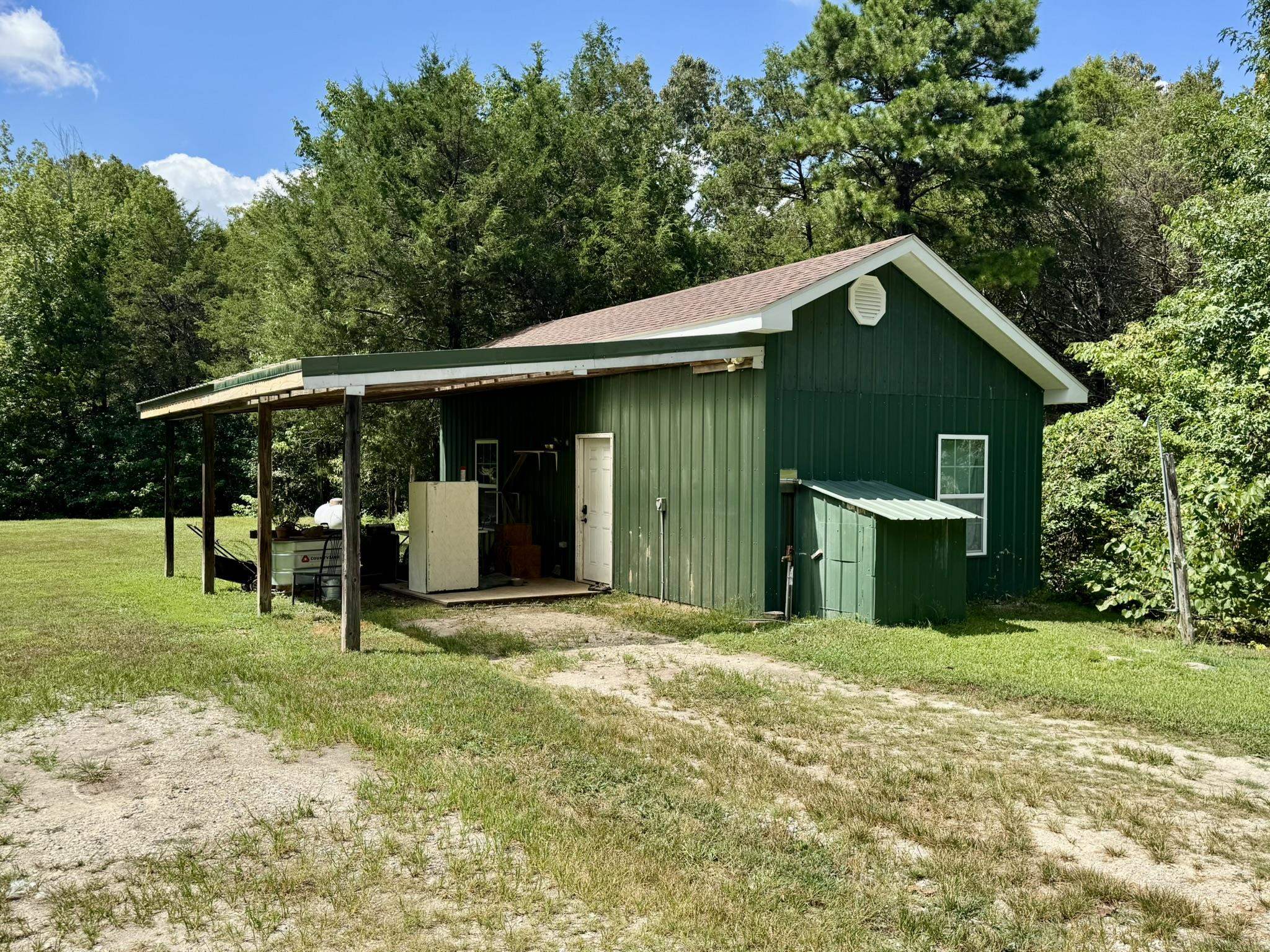 1 bedroom, 1 bath home on 10.32 acres just outside of Melbourne! This cozy home offers an open floor plan with a functional kitchen with plenty of storage, a covered outdoor area, plus a new roof in 2025. The acreage is mostly wooded, providing privacy and a natural setting, while also offering plenty of room to expand. Additional features include a fenced chicken area with coop, a fenced garden space ready for planting, and a 12x24 workshop with power and insulationāperfect for projects or storage.