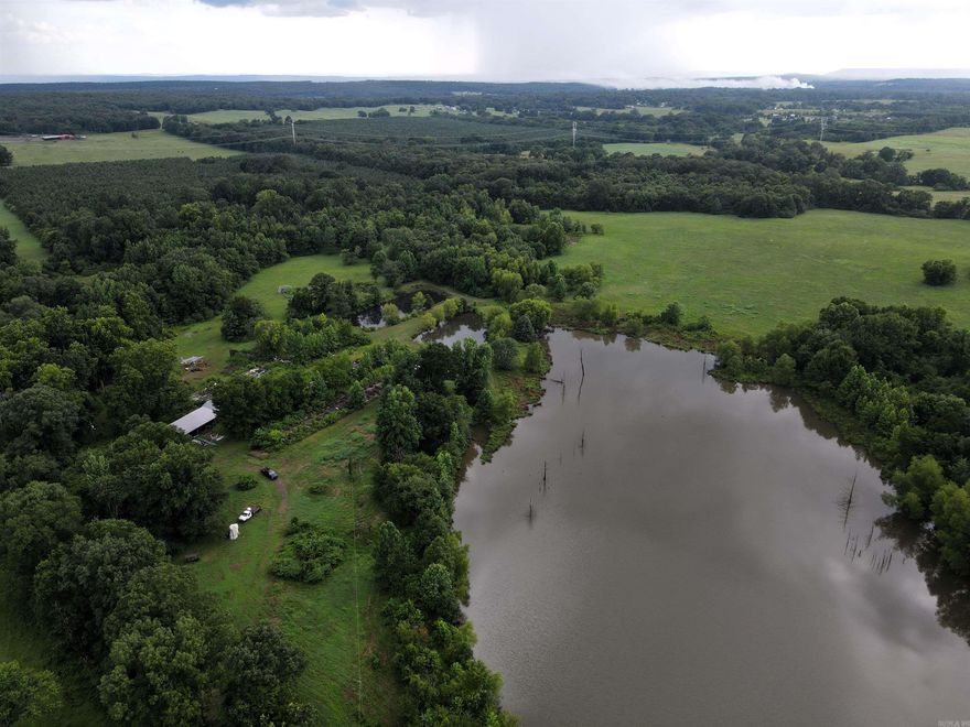 - 25 +/- acres of pasture - 5.75 +/- acres of ponds - Perimeter fencing - Small equipment shed - Mixed aged hardwood timber - Rural water - Electricity - Deeded easement access - Outstanding deer & waterfowl hunting - 10 miles to Morrilton - 16 miles to Conway