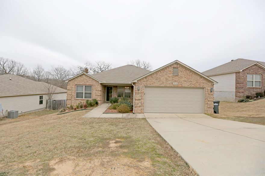 Step into your new residence situated in the sought-after Sherwood area, specifically in the Bear Paw Addition. This neighborhood is conveniently positioned across from Sylvan Hills High School and just minutes away from Elementary and Middle Schools, as well as shopping and other amenities. The home features three bedrooms and two bathrooms, with hardwood floors gracing the living room that seamlessly connects to the kitchen. The kitchen itself boasts granite countertops, sleek black appliances, and an island for added convenience. The bedrooms are generously sized, and the bathrooms are well-appointed. Outside, a deck awaits, providing an inviting outdoor space.