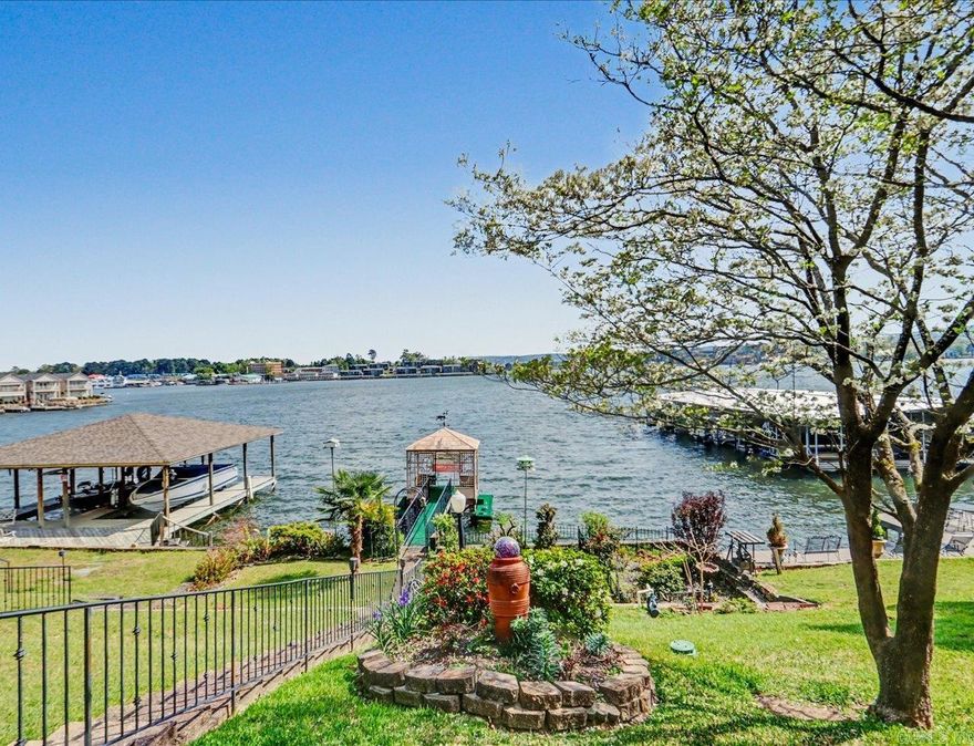 Prime Lake Hamilton Living in the Heart of Hot Springs  Offered for the first time in 50 years, 165 Pretti Point is a rare opportunity to own a beautifully updated Lake Hamilton lakefront home with open main-lake views in one of the most central locations on the lake. Located just off Highway 7 and Central Avenue, less than 4 miles from Oaklawn Racing Casino & Resort, this property offers easy access to shopping, dining, and entertainment while enjoying peaceful lakefront living.  Situated on a quiet, no-through street, the home offers privacy and minimal traffic. Enjoy spectacular lake views from the covered porch, deck, and patio, including views of Lake Hamilton fireworks, sunrise mornings, and sunset evenings. A neighborhood boat launch provides additional convenience for lake access.  The main level features two bedrooms and two full baths, a spacious open floor plan, and a sunroom with panoramic lake views. The primary suite includes a large walk-in closet, and the sunroom opens to a lake-view deck ideal for entertaining. The lower level, accessed separately, includes two additional bedrooms, a full bath, den, man cave, laundry room with sink, and patio access—ideal for guest