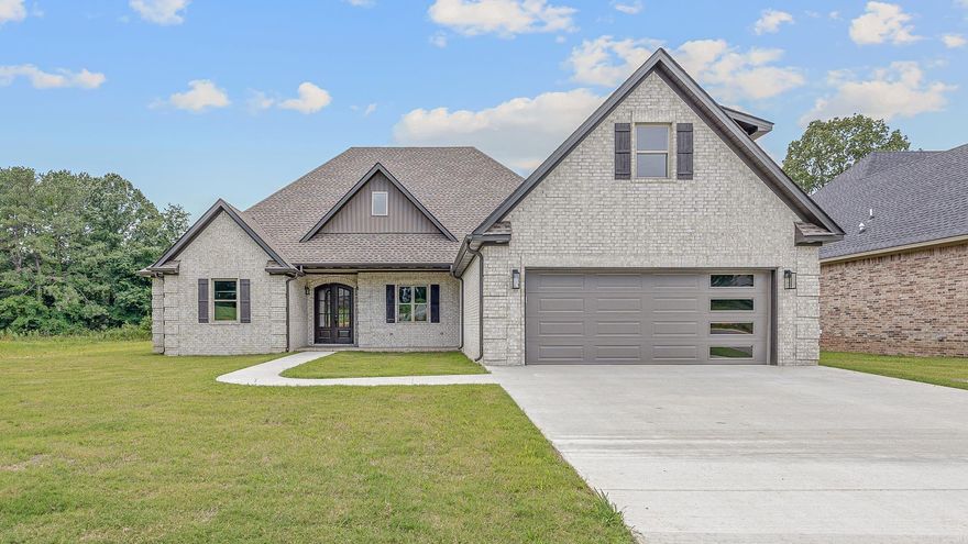 Discover contemporary elegance in this brand new home located just South of the bypass in the Jonesboro School District. Boasting 3038 sq ft+/- of luxurious living space, this meticulously crafted residence is designed for comfort and style. The interior features, 4 bedrooms, 3.5 bathrooms, media/office, study, a custom kitchen with granite countertops and Bosch appliances. The living room is inviting with a gas log fireplace, vaulted ceilings accented by a 72 inch ceiling fan. The master bedroom feature abundant closet space, and the master bath has a spacious walk in tiled shower. The front door and rear porch boasts stamped concrete with a toung and groove ceiling. Garage doors with windows provide plenty of natural lighting for the garage and the exterior Terra Tone color adds a special touch! Call today for a private viewing!