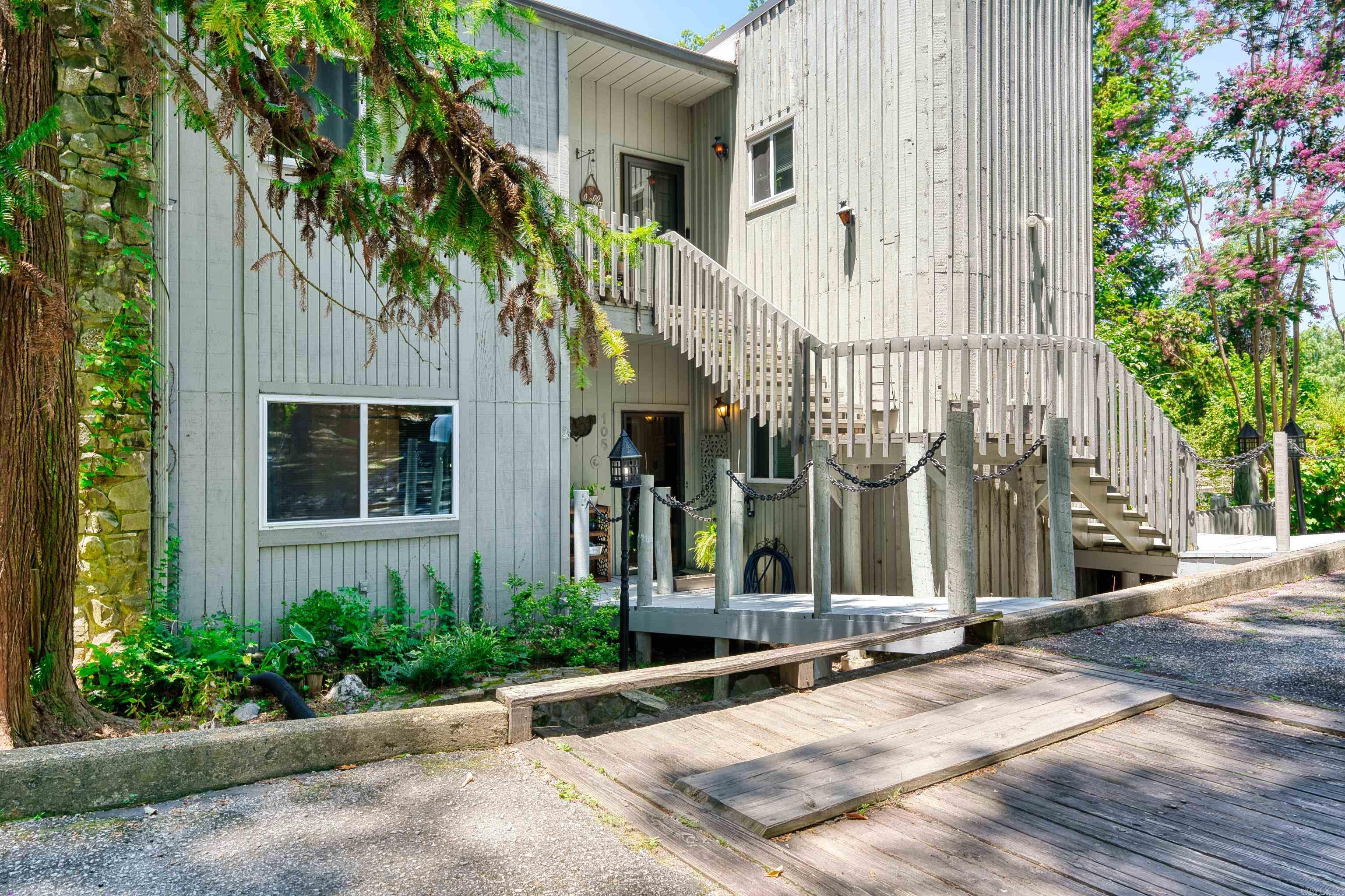 Don't miss this ground floor city condo with a private balcony overlooking the community pool. This condo features hardwood floors in the living spaces and a stunning stone fireplace. Recent updates include granite countertops, stainless steel appliances, modern fixtures, energy efficient windows and sliding glass doors. Experience classic elegance with the ease of modern comfort in this meticulously updated home.