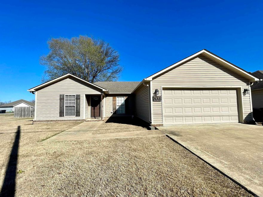 Cute and convenient location in Trumann, Arkansas. Just 15 minutes to Jonesboro and 45 minutes to Memphis. This 3 bedroom, 2 bath home is all electric and low maintenance with vinyl siding on a slab foundation. There is a 2 car garage, fenced backyard, back patio, and it's on a large corner lot (0.27 acres). The primary suite is laid out well with a large walk in closet. One of our favorite things about this home is that the kitchen and open dining are at the back of the home with views to the fenced backyard. Schedule your private tour with your favorite REALTOR® and make this house your own!