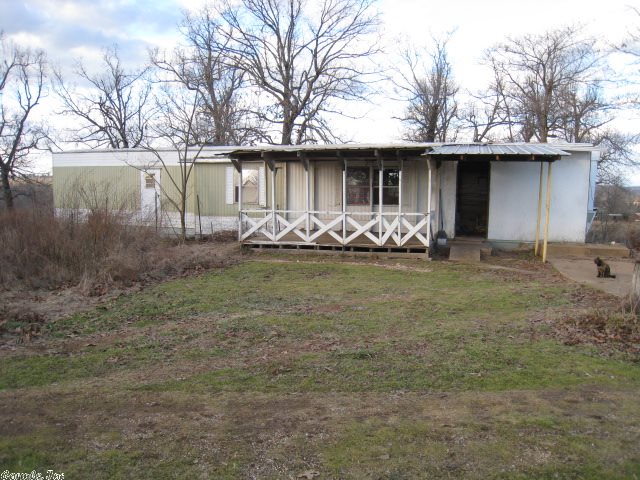 15 ACRE HOBBY FARM with a 2-bedroom, 1-bath mobile home w/addition. All fenced with pasture and 1 pond, 24 x 48 shop with concrete floor and electric, plus a 24 x 24 metal building. $37,500