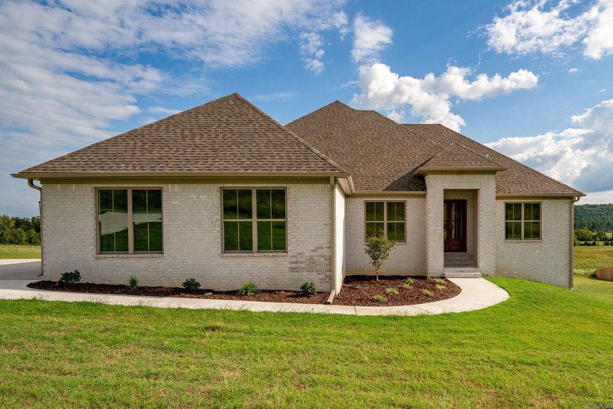 Beautiful custom-built new construction 4 bed/2 1/2 bath Greenbrier home sits on almost an acre in Reynolds Ridge! Wonderful open floor plan with large living room and beautifully designed kitchen with custom cabinetry, quartz countertops, stainless steel appliances, center island, walk-in pantry & separate dining area. The primary suite features double sinks w/split vanities, soaker tub w/tile surround, tiled walk-in shower, & walk-in closet w/access to the laundry room. The guestrooms are all a great size & share a wonderful hall bath w/double sinks & tub/shower w/tile surround. The mudroom has built-in w/coat hooks, bench seating & cabinet/cubby storage. The exterior features nice landscaping, a gorgeous back deck, 2 car garage & huge lot.