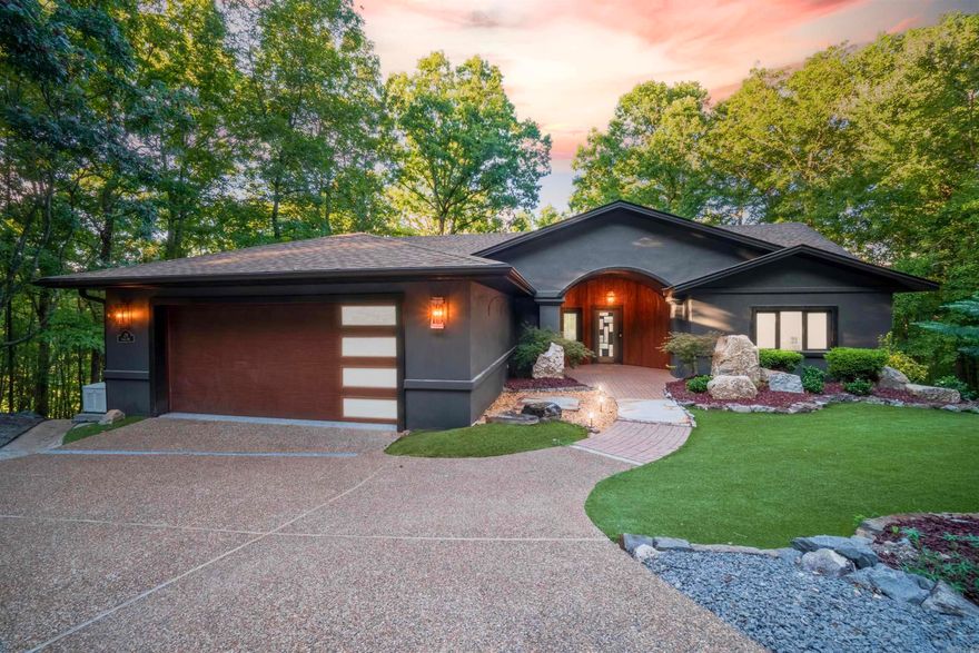 Welcome to this beautifully appointed 4-bdrm, 2.5 bath home boasting 3,428 sq ft of thoughtfully designed living space-crafted for comfort, function and elevated living.  Nestled in a prime location overlooking the #4 pond, fountain, green and fairway, this home offers breathtaking views from nearly every room.  The expansive open-concept main level features a spacious kitchen with a large island and breakfast area, framed by a wall of windows that showcase the scenic outdoors.  Perfect for entertaining, the lower level also includes a theater/ media room and covered decks, ideal for relaxing or hosting gatherings year around.  The home offers excellent flexibility with a second master suite--perfect for multigenerational living or accommodating guests in privacy and comfort.  The lower level is a true entertainment haven, complete with a sleek wet bar featuring an ice maker and beverage cooler, a bonus bedroom and a large flex space that can serve as a home gym or office.  Outside enjoy beautifully landscaped, low maintenance grounds and small fenced yard.  The multiple decks offer ample space to unwind or entertain while taking in the tranquil surroundings.