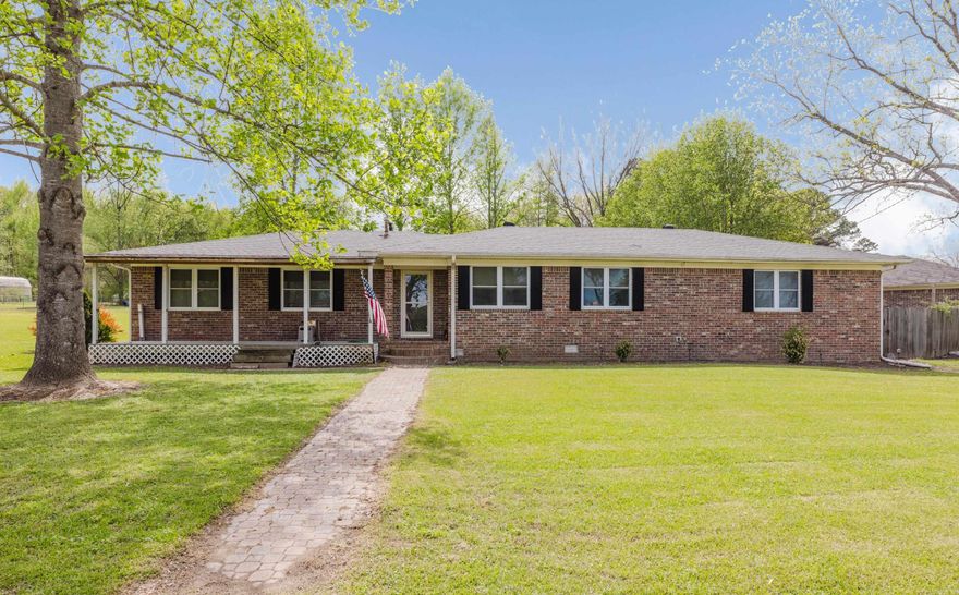 Beautiful all-brick home with 1.25 acres and a shop. Peaceful country living but still close to town. LVP flooring with tile in the baths and no carpet! Huge living room open to the kitchen and dining area with tons of natural light! Nice kitchen with stainless steel appliances, an electric stove, walk-in pantry, eat-in area, and abundant counter and cabinet space. Major updates include a new roof in 2023, HVAC replaced in 2017, and a tankless water heater. Large primary suite is a standout with sliding barn doors, two large closets, built-in dresser drawers, an additional walk-in closet, and a beautiful bath featuring a custom tiled walk-in shower with glass doors, granite double-sink vanity with soft-close drawers, and double medicine cabinet mirrors. Washer and dryer are conveniently located in the primary bath. The 2nd bath offers a custom tiled tub/shower combo and vanity. Outside, enjoy the large trex back deck, welcoming trex front deck, fenced yard, and impressive shop with an 11x22 heated and cooled space perfect for an office, hobby room, or additional living area. Close to several beautiful lakes and golf courses. Only 9 min to the interstate for an easy commute!