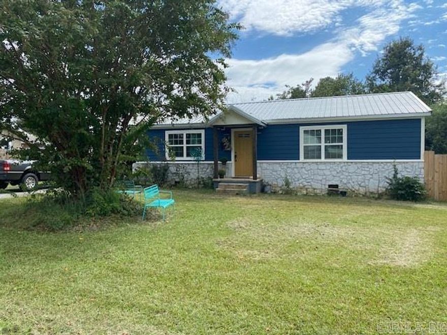 Adorable 2 bedroom, 1 1/2 bath home sits just inside the city limits of Mena. Home was completely remodeled in 2021 along with a new HVAC in 2022, new dog-eared privacy fence, new electrical in the outbuilding and a survey was done in the past 3 years. The home features gorgeous granite countertops in the kitchen and bath, soft close cabinet doors, lovely subway tile in bathrooms. Living room has beautiful shiplap wall with a flush-mount electric fireplace and feels open and spacious.  Call for your private showing!