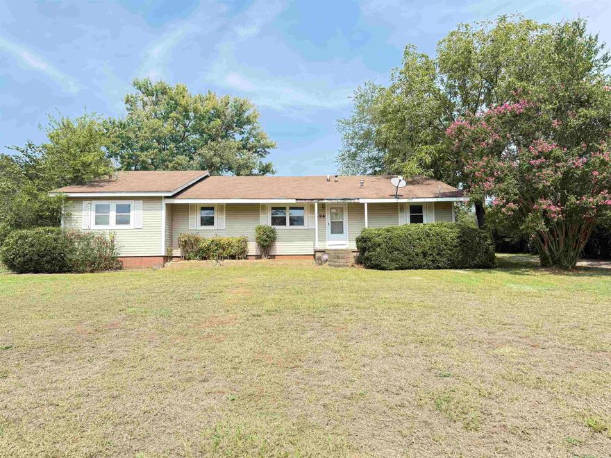 Investor special with endless potential! Sitting on a peaceful .77-acre lot just outside of Benton, this property is perfect for someone looking to bring their vision to life. The spacious layout features an open living area, wood-burning fireplace, and a screened-in porch ideal for relaxing or entertaining.  Additional features include a huge detached shop with tons of space for storage, projects, or equipment, a whole-home generator, and plenty of room to reimagine or rebuild. This home needs a full renovation, but the character and setting make it a true diamond in the rough.  Cash buyers only. No property disclosure available. Sold as-is.