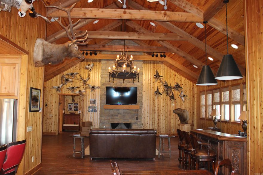 Big Cypress Creek Grand Lodge & Waterfowl Reserve is a rare 311± acre legacy waterfowl property in Eastern Arkansas along Big Cypress Creek in Monroe County—an area long known for consistently holding mallards. With two permanent blinds and natural stand-and-shoot spots tucked along the creek, it delivers the classic Arkansas timber hunt built on tradition. The habitat is dialed in: creek-side cover, conservation-designated areas, and two east-side fields typically planted in rice to attract and hold ducks. Two boat houses and two boats make getting to the action easy at daylight or for afternoon setups. Just 12 miles north near Hwy 49/79 on McKoy Lane, the elegant 6,100± sq ft lodge elevates the entire experience. A grand gathering room with a massive rock fireplace, bar, and spacious kitchen/dining areas set the tone for entertaining. Six luxury suites—each with a full walk-in shower and cedar closet—offer true retreat-level comfort. Add a gun room, personal lockers, and purpose-built spaces including a cleaning room and wader room, and every detail is designed for a premium sporting lifestyle.  Lodge can be purchased separately.