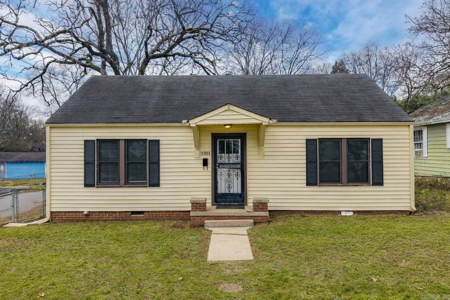 3301 W 7th Street is a classic 2 bed, 1 bath home in Capitol View that hits the sweet spot of location, layout, and livability. Just minutes from downtown, UAMS, and major corridors, this is the kind of address that keeps demand steady whether you’re buying to live in it or adding to a rental portfolio.  Hardwood floors run through the living areas and bedrooms, adding warmth and character, while the layout feels open, bright, and easy to live in.  The kitchen offers great flow and connection to the main living spaces, plus a dedicated laundry room — a practical bonus you don’t always find in a home this size. The bathroom is centrally located and easily accessible from both bedrooms.  Out back, a covered porch creates usable outdoor space, and the detached garage offers valuable storage or workshop potential.  Located just minutes from downtown, UAMS, and major routes, convenience is built in — and so is long-term demand.  For an owner-occupant, it’s an affordable path to homeownership and equity. For an investor, it’s a solid opportunity in a central neighborhood. Simple, smart, and full of potential. Don't miss out on this great opportunity!