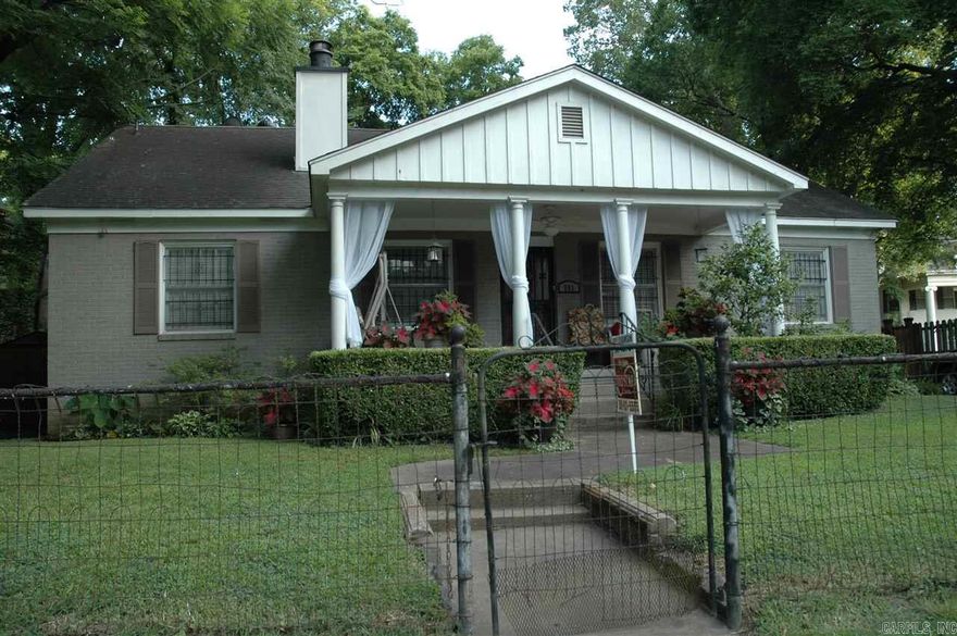 You've got to see this one. Excellent entertaining location within walking distance of River Market, shops & stores, McAurthur Park, UALR Law School, Clinton Library, LR Library.  Home boasts spacious 3 bdrms, 2 full baths on main level. Finished attic used as gameroom/office. Original hardwood floors throughout, carpet in some rooms. Wood burning FP. Custom site-built kitchen cabinets with all the bells & whistles.  Designer bath upgrades. Fully fenced front and back yards. Don't miss this one.