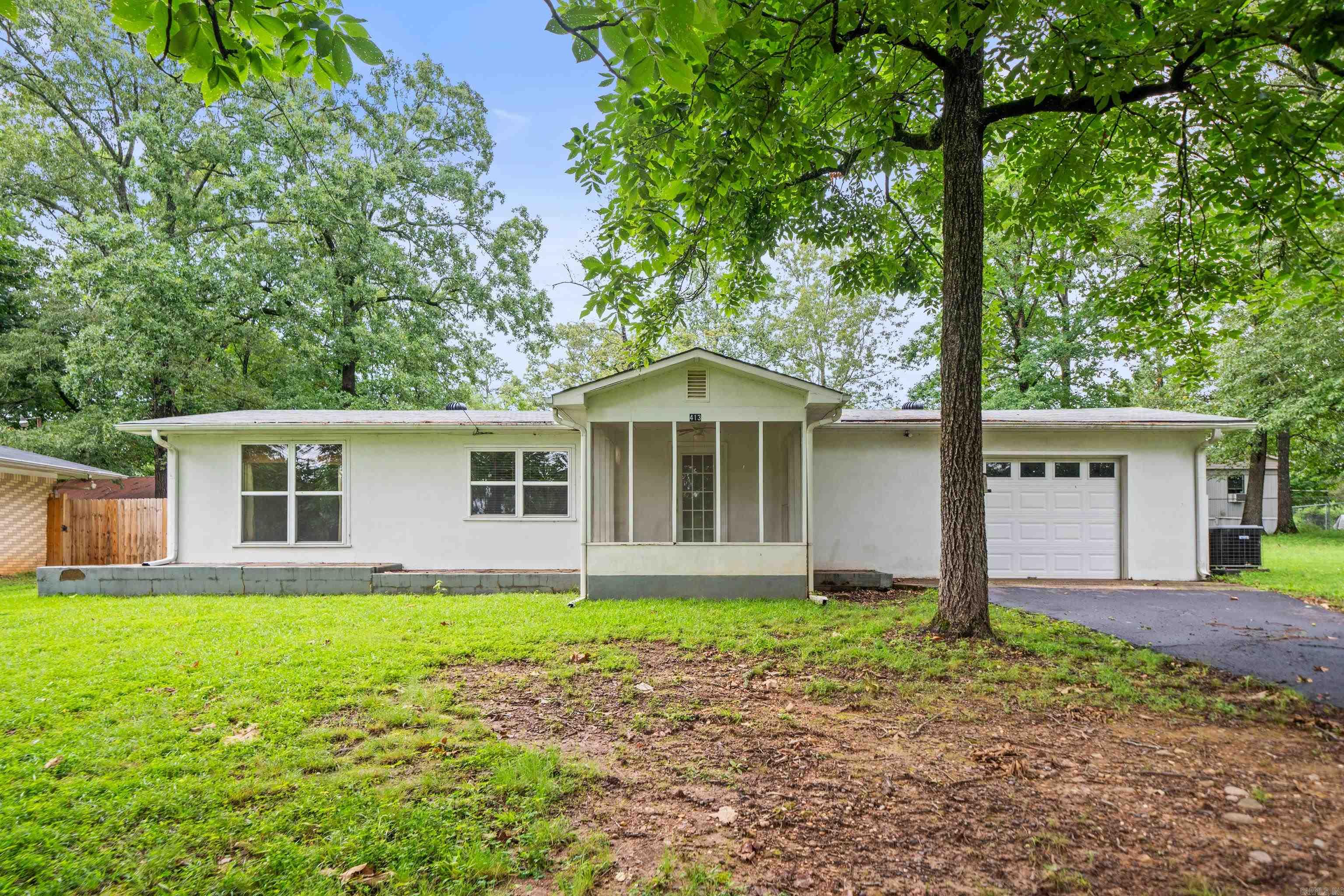 A Perfect Investment! For investors or those seeking a vacation property, this gem presents an exceptional opportunity. Its desirable location near Lake Hamilton positions it perfectly for rental potential or as a weekend getaway that could pay for itself. Whether you're downsizing, investing, or searching for your perfect lake-adjacent retreat, this property delivers charm, location, and potential in one delightful package! Don't miss this great opportunity! Ready to renovate to your style. Lake access and boat ramp down the street.