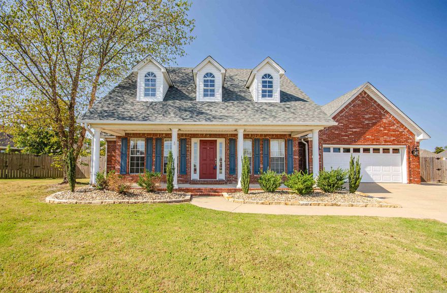 This beautifully landscaped home features a magnificent front porch, fully fenced in back yard with a patio and pergola; a 2 car garage with an additional parking pad and storage building to convey (awning does not). Inside you'll find a spacious open, split floor plan, kitchen with granite counter tops, stove and microwave that is less than a year old; a home office, a large master bathroom with a tile shower, and so much more! HVAC is less than a year old. and roof is less than 4 years old.