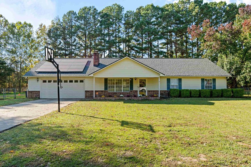 Welcome to this charming 3-bedroom, 2-bathroom home set on over half an acre—the perfect blend of space, comfort, and functionality. Inside, you’ll love the open-concept kitchen, living, and dining area, ideal for everyday living and entertaining. The kitchen features marble countertops and plenty of storage, all flowing seamlessly into the spacious main living spaces.  Updates throughout include fresh paint, new carpet, and modern finishes, giving the home a clean, move-in-ready feel.  Outside, the property continues to shine with an extra-large garage and a 30x30 shop, offering endless possibilities—workshop, storage, hobbies, or even a small business setup. The expansive yard provides room to play, garden, or create your dream outdoor space.  Located in a peaceful area of Jacksonville, this home offers privacy with convenient access to local amenities. With tons of upgrades and rare outdoor space at this price point, this one is truly a must-see!