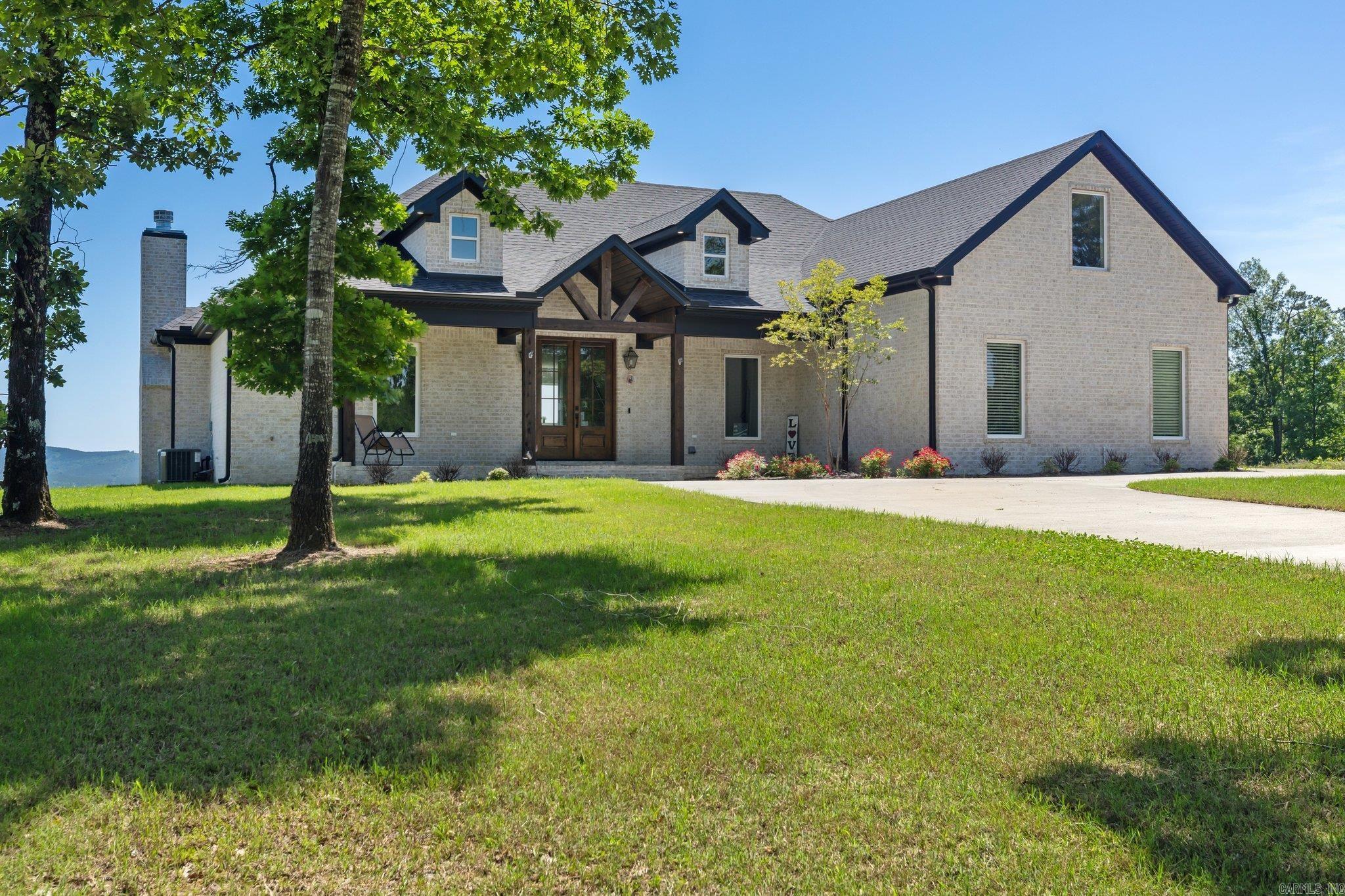 Beautiful home on over an acre of private property with an incredible view overlooking Lake Maumelle and the western mountain range. This estate is just inside the gated neighborhood Lakeview West. The home boast an open floor plan designed to maximize window space allowing tons of natural light into the home while capturing the amazing views. The beautiful home has four bedrooms and three bathrooms as well as a spacious living and eating area off the kitchen. The home also has a large utility room and a large bonus room upstairs. The home sits on rare property as it not common to have an incredible view while still having the luxury of a large flat backyard. This is truly a unique estate. For VA loans this home has an assumable loan at 4.5%. Call for details!