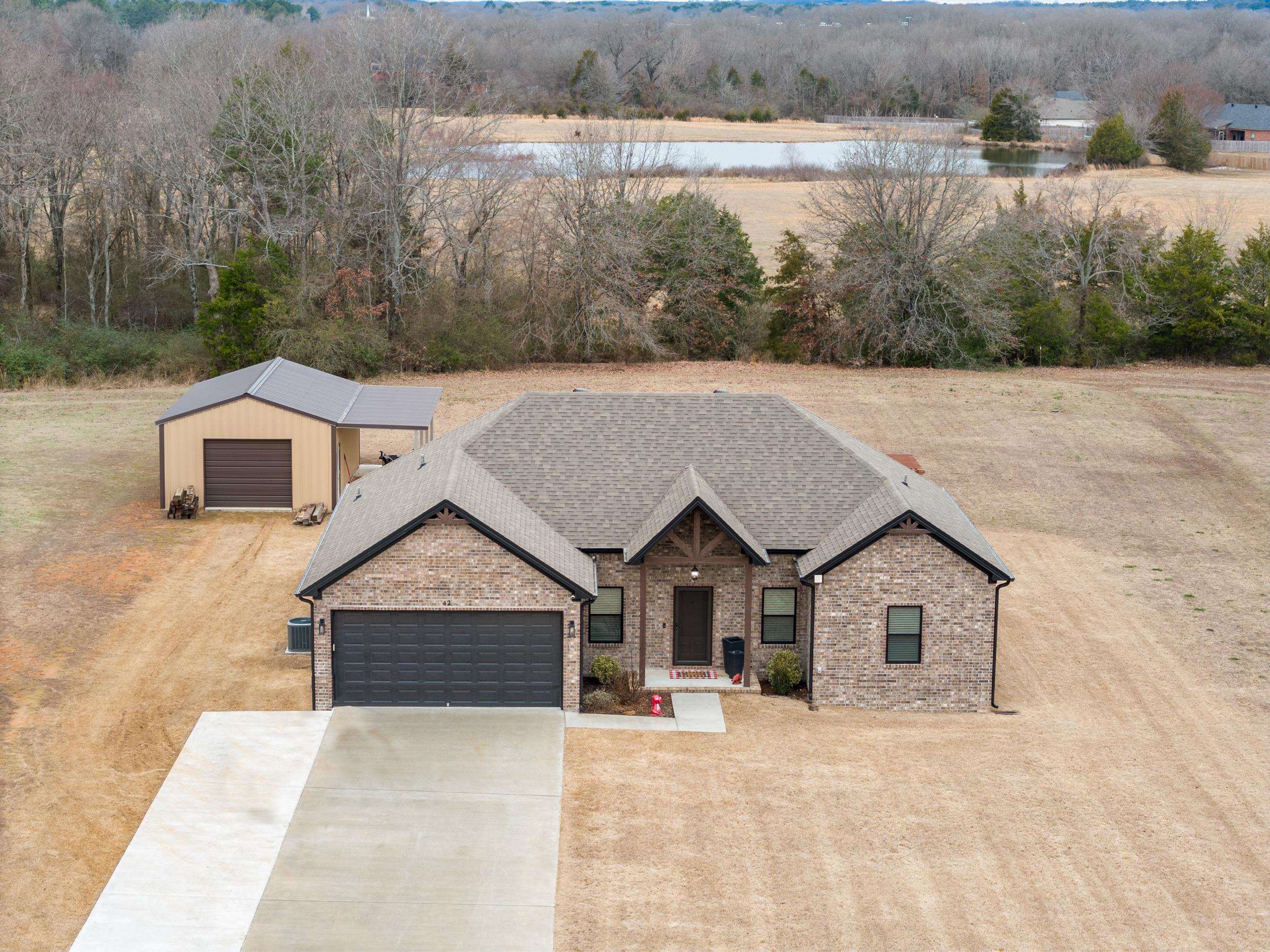 Come see this well maintained, one level, move in ready home. This floor plan features an open kitchen/living/dining space, split floor plan with great closets, walk in laundry room and 10 ft. ceilings. Bathrooms and Kitchen have granite countertops. Home is nestled on a level, cleared 1 acre lot and has plenty of space for the family and animals. Back deck was added onto with additional 10x10 deck for additional space to hang out and grill. Sellers also built a 20x30 shop with a 10 ft. lean to perfect for storage or to create an awesome work space. AGENTS READ REMARKS!!!