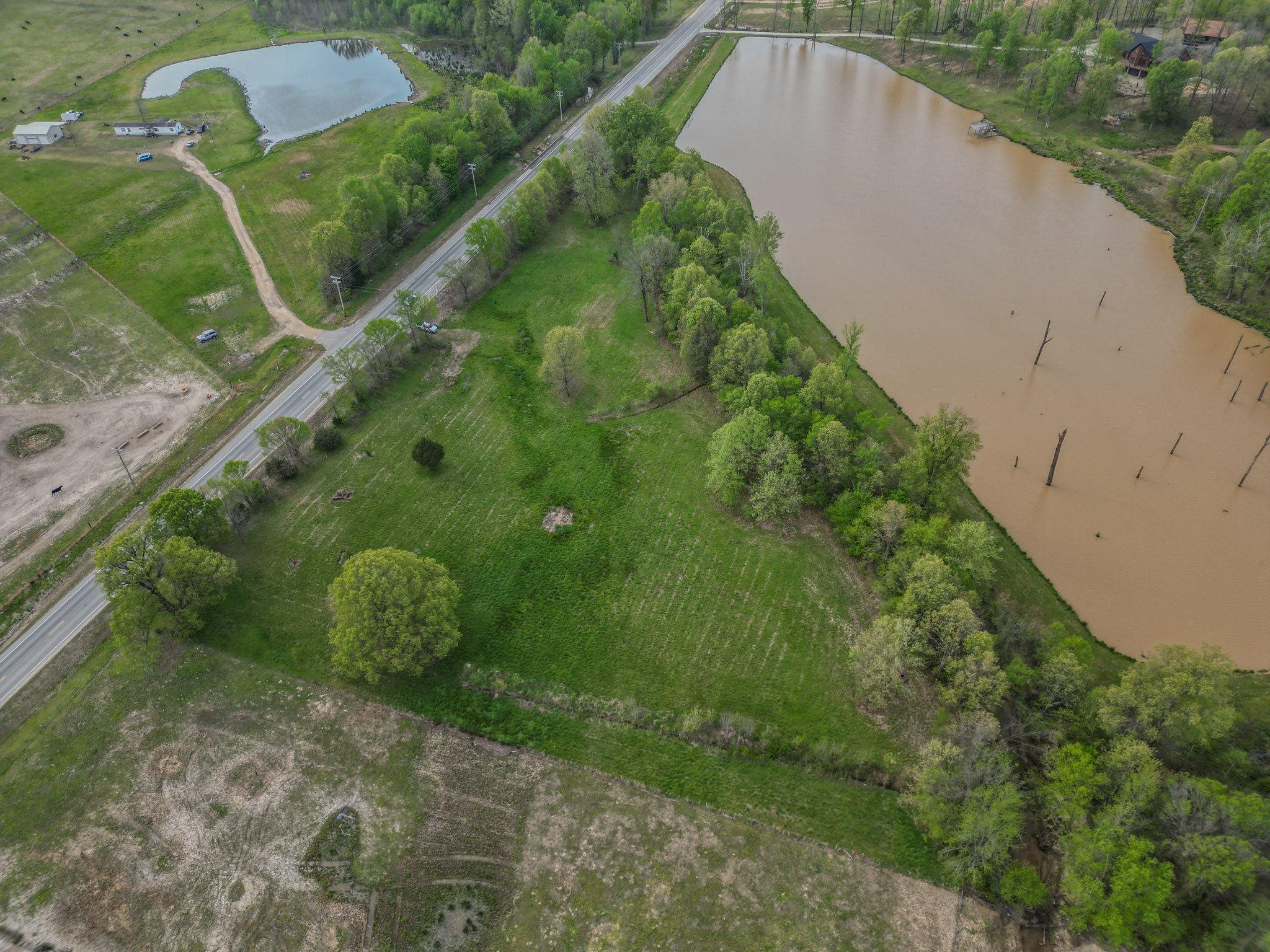 Located just outside the city limits of Paragould, this 5.38-acre property offers the perfect opportunity to create your dream setup with no restrictions. With paved frontage along Highway 135 N and a private entrance already in place, access is easy and convenient. The land is cleared with a beautiful tree-lined border, providing both open space and privacy. Some utilities are already on the property, saving you time and hassle when it’s time to build. Whether you're ready to build now or want to invest for the future, this property offers flexibility, freedom, and a great location in Northeast Arkansas.