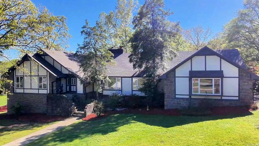 Spacious 5 bedroom, 3 full + 2 half bath home with 4,036 sq ft on 3.49 private acres in Hot Springs, AR—ideal for large families, multi-generational living, or investment as a proven income-producing short-term rental/Airbnb. This cozy, warm, and inviting home features natural light, large living areas, and a finished walkout basement with wet bar, game room, and entertainment space. Step outside to a resort-style backyard oasis with in-ground pool, outdoor kitchen, covered patio, multiple seating areas, fountains, beautifully landscaped grounds along with a play are for children and full basketball court with seating—perfect for outdoor living and entertaining. Enjoy peaceful, private acreage with room to expand, garden, or add recreation. Located near Lake Hamilton, Oaklawn Racing Casino Resort, downtown Hot Springs, shopping, dining, hiking trails, and national park attractions. This property offers luxury, privacy, and convenience—perfect as a primary residence, vacation home, or turnkey rental investment opportunity.