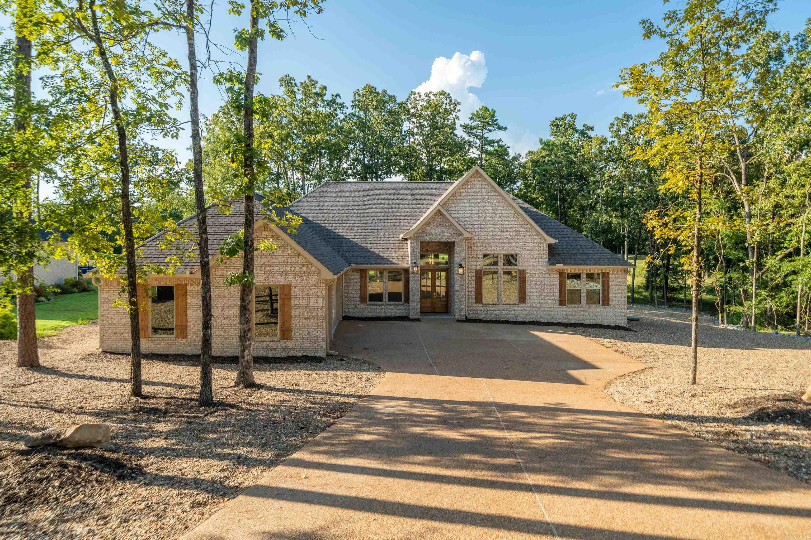 BUILDER WILL PAY DIAMANTE CLUB DUES FOR 3 YEARS, A $30,000.00 VALUE. A great combination, Diamante\s award-winning golf course and rated in the top three in Arkansas and award-winning Carriage Homes 7-time homebuilder of the year in HSV. If you want on the course with a view, try this one out. Many of the Diamante promotional pictures are shot in the back of this house on the#11 Fairway. That's how good the view is! This 3 BR, 2 1/2 Bath, 3 car garage is just as stunning as the view. Decorated in the latest neutrals with a bar in the kitchen big enough to sit 6-8 of your closest friends so they too can enjoy your view. Gorgeous primary bedroom and bath with huge walk-in closet. Storage galore including a walk- up staircase with storage in the attic. Bring the family and friends over and let them enjoy your private country club. They can play three rounds of golf a month free. Of course, you can play everyday!