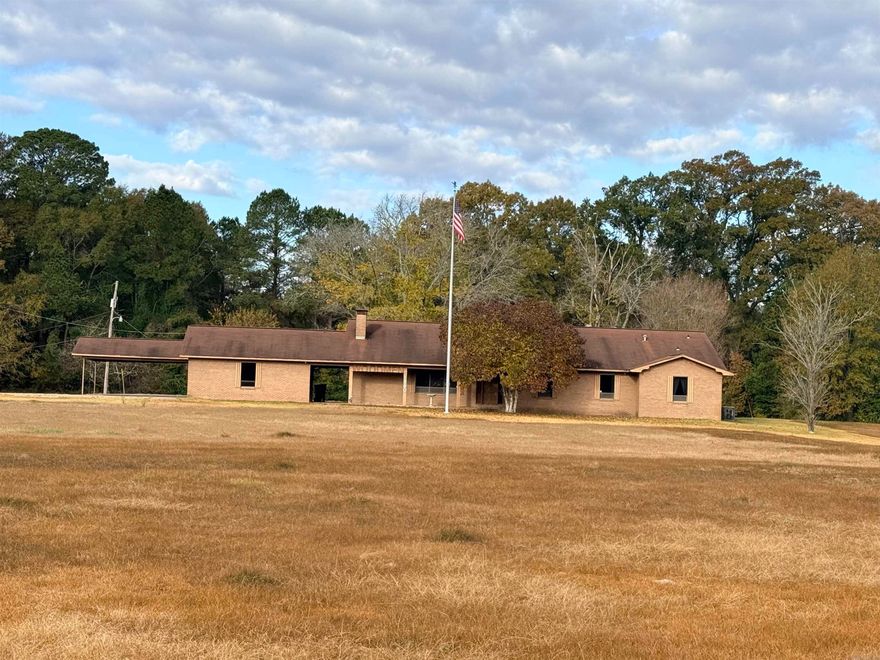 Commercial Property – Over 3,700 Sq. Ft. on 5 Acres! High-Traffic Location! Don’t miss this incredible opportunity to own a spacious brick commercial building offering over 3,700 sq. ft. of versatile space on 5 acres in a prime high-traffic area. This property is packed with features to fit a wide range of business needs! Step inside to a large lobby/reception area, perfect for greeting clients or customers. Enjoy the convenience of a full, spacious kitchen, a large laundry area with abundant storage, and multiple office spaces—up to 5 separate offices—providing room for staff, files, and equipment. The building also includes 4 full bathrooms, walk-in closets, and additional storage throughout for files, supplies, or inventory. A double carport with two large storage rooms adds even more functionality and convenience. Whether you’re expanding your current business or starting something new, this property offers the space, flexibility, and location you need!