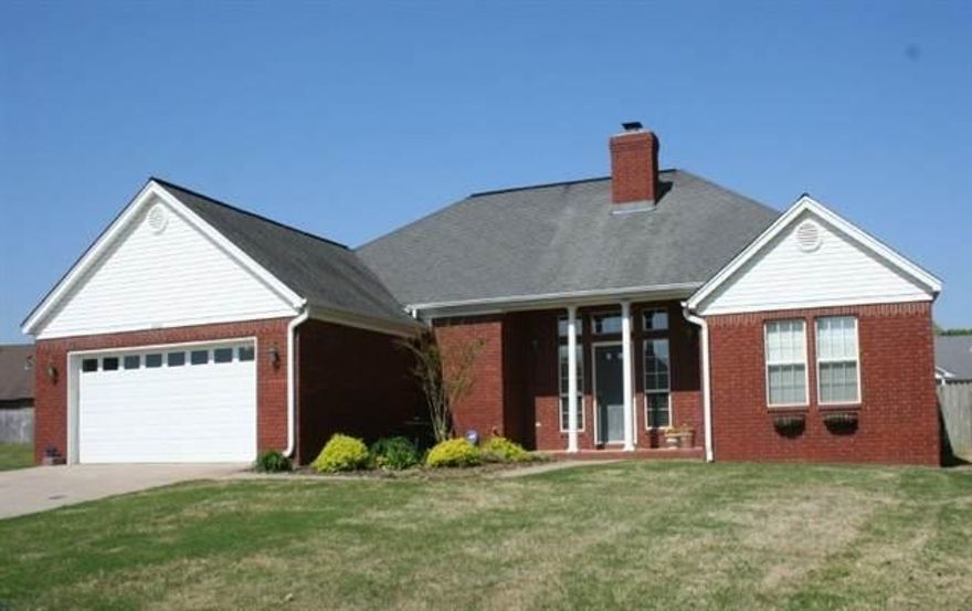 This 3 bedroom, 2 bath house has it all. Living room has 10' ceiling with accent lighting, wood burning fireplace with gas starter & built-in bookcases.Hardwood floors in entry. Security system. Master suite has built in desk, a tray ceiling & a sitting area in bedroom. Master bath has dual His & Hers walk-in closets, dual sink vanity, jetted whirlpool tub and separate walk in shower. All bedroom are large. Outside is a fenced backyard with storage building. Sprinkler system.