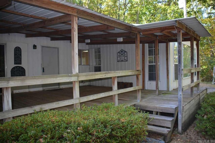 Quiet lakefront low Maintenance metal home with metal roof, lots of privacy, dead end road, just under 2.5 acres and gentle walk to Over 200' of lakefront, views of Diamond bluff and Eden Isle areas and all the way across to the north side of the lake The kitchen & dining area are part of the great room, plenty of space for a large group to gather eat and watch you favorite sports team,  Separate second living area that could be 3rd bedroom / bunk room or office,  2 full baths, Over 600 sf of covered deck with a view of the lake, to hang out and grill with family and friends or just you and your dog, existing ATV/walking trail to the to the lake. gentle slopeing shoreline to enjoy an afternoon swim or pull your boat up to for the weekend, Property has city water and a working well, No heavy traffic in this area. Owners have kept the home immaculate. Furniture to convey