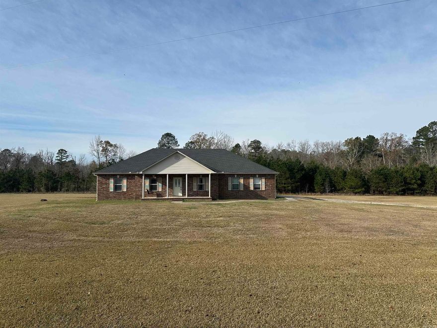 Spacious Custom Home on 3.56 Acres! This beautifully crafted 4-bedroom home sits on a generous 3.56-acre lot, offering space, privacy, and quality throughout. Originally built as a custom home, it’s packed with high-end features that set it apart including real hardwood floors, elegant crown molding, tray ceilings, and a thoughtful split floor plan for added privacy.  You'll love the dedicated dining room, oversized master suite, and the convenience of a 2 car garage. With all bedrooms thoughtfully separated and plenty of room to spread out inside and out this property is perfect for anyone seeking comfort, style, and space to grow.