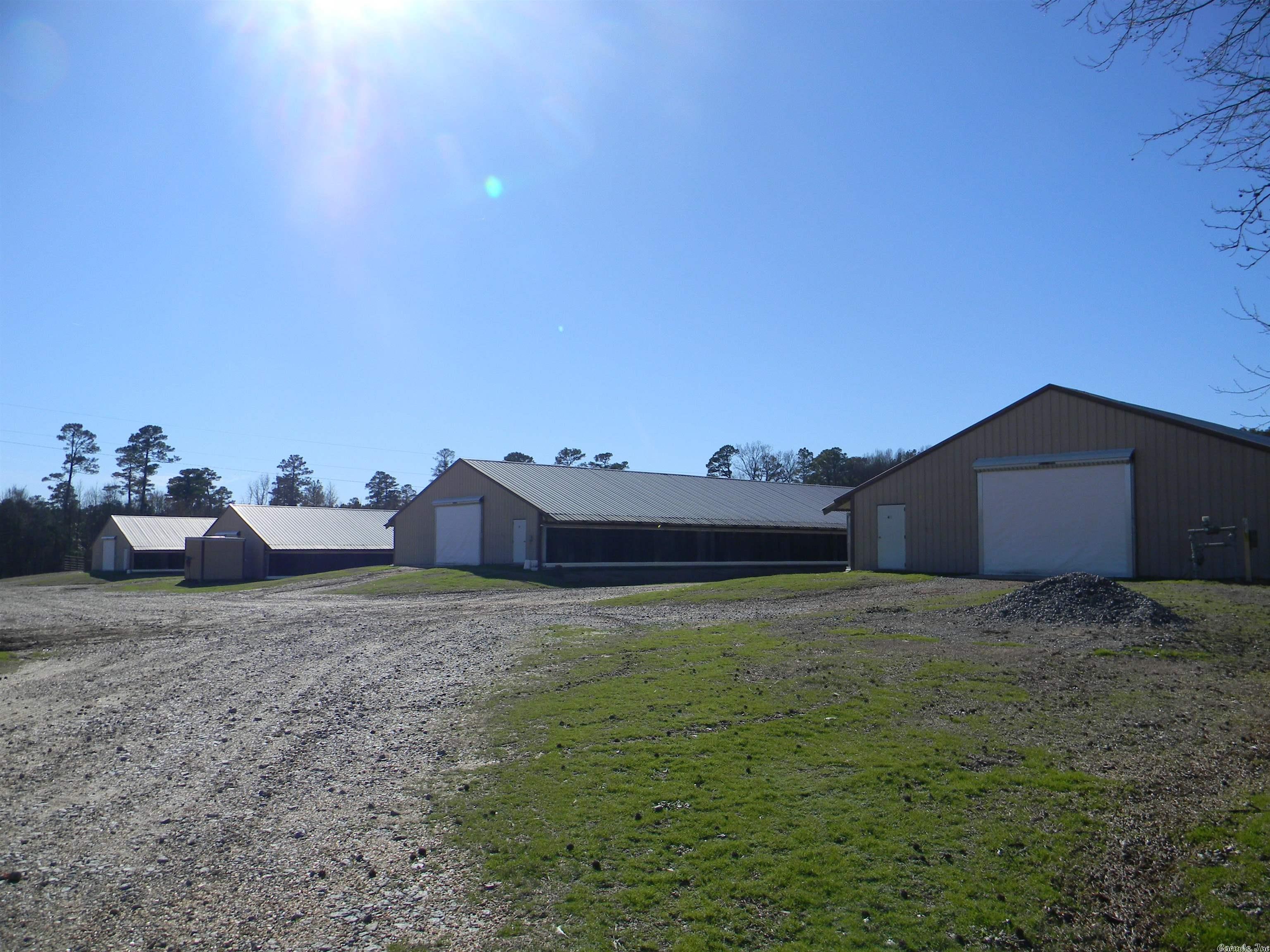 4 Clean, well upkept and upgraded 40 X 500 Broiler Houses , 2 liter sheds, 2 more sheds, Single wide mobile home with addition, pond and sitting on 10 Aces. Partially fenced. Chicken houses are on Natural Gas. 125 KW backup generator. Houses are in operation and are under Tyson contract.