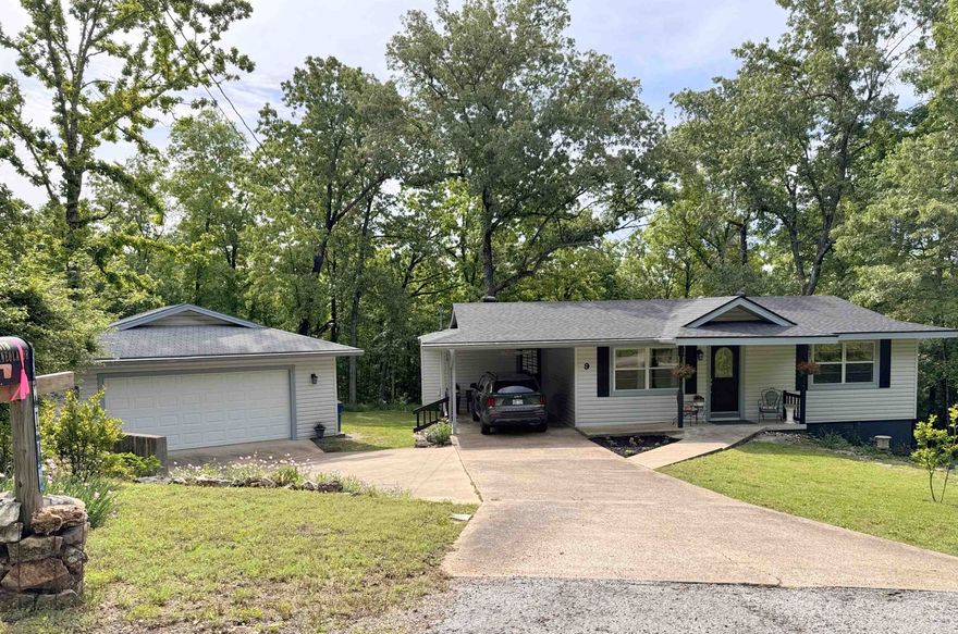 Updated 3 bedroom 1.5 bath house on about 0.6 acres, with a detached 24'x24' double garage and carport.  This move-in ready property features include new roof 2023, Vinyl plank flooring 2024, fresh paint inside and outside 2024. HVAC is dual fuel.  There is a kitchen big enough for serving a crowd, a dining room overlooking the private back yard, a pantry/washer-dryer room with lots of storage and counter space. There is even a second washer-dryer area off the kitchen. There are numerous closets.  The basement has storage and contains the furnace and water heater. Additional outdoor covered space is available for storing yard tools, and outdoorsy stuff.  A small shed with lean-to provides more enclosed space and cover a boat or canoe.  Need a workshop or covered parking-enough 3 vehicles? This property has it.  The yard is bedecked with numerous flower and garden beds bordered with native stone.  Several frost-free water faucets are installed about.  The yard is full of ornamental shrubs, bushes and flowers with paths winding among the beds. No close neighbors provide privacy but one is still just minutes away from lakes, golf courses and area shopping.