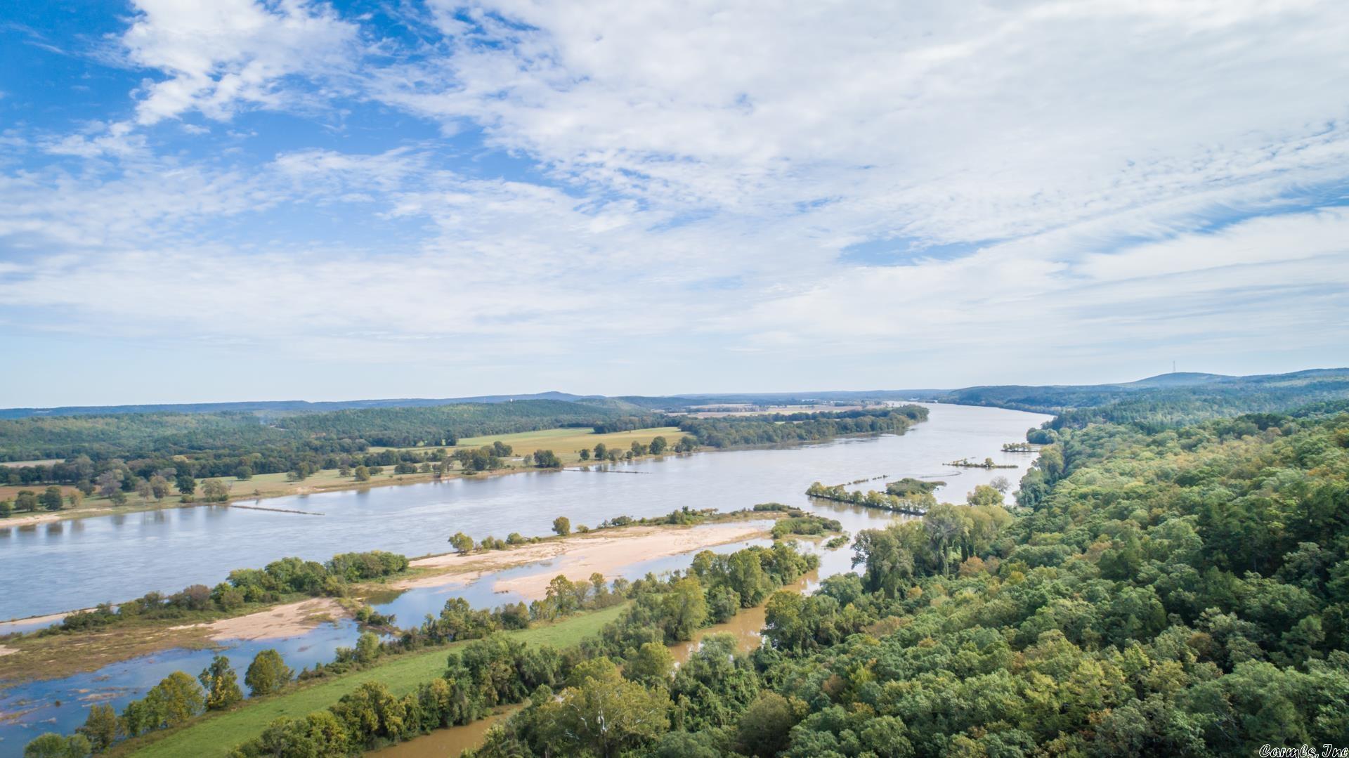 This is not the exact location. Please call for directions. The Palisades lots, located in Perry County, are accessed from West Wind Road, approximately 35 minutes from West Little Rock and 30 Minutes from Conway. The property overlooks the Fourche La Fave River, and the Arkansas River is in view on the drive into the lots. There is access to both rivers via tributary. The views are amazing; you can see all the way to Conway when you are looking to the north, and if you are looking south, you are looking at mountaintop views over timberland. Electricity and city water is available to each lot, except for lots 19 and 20, but can be extended to those lots. This entire package includes all 14 lots totaling 173 acres. A copy of the Bill of Assurance can be provided upon request. The owner of these lots has enough votes to change the BOA if desired. You want to take advantage of this incredible investment opportunity!